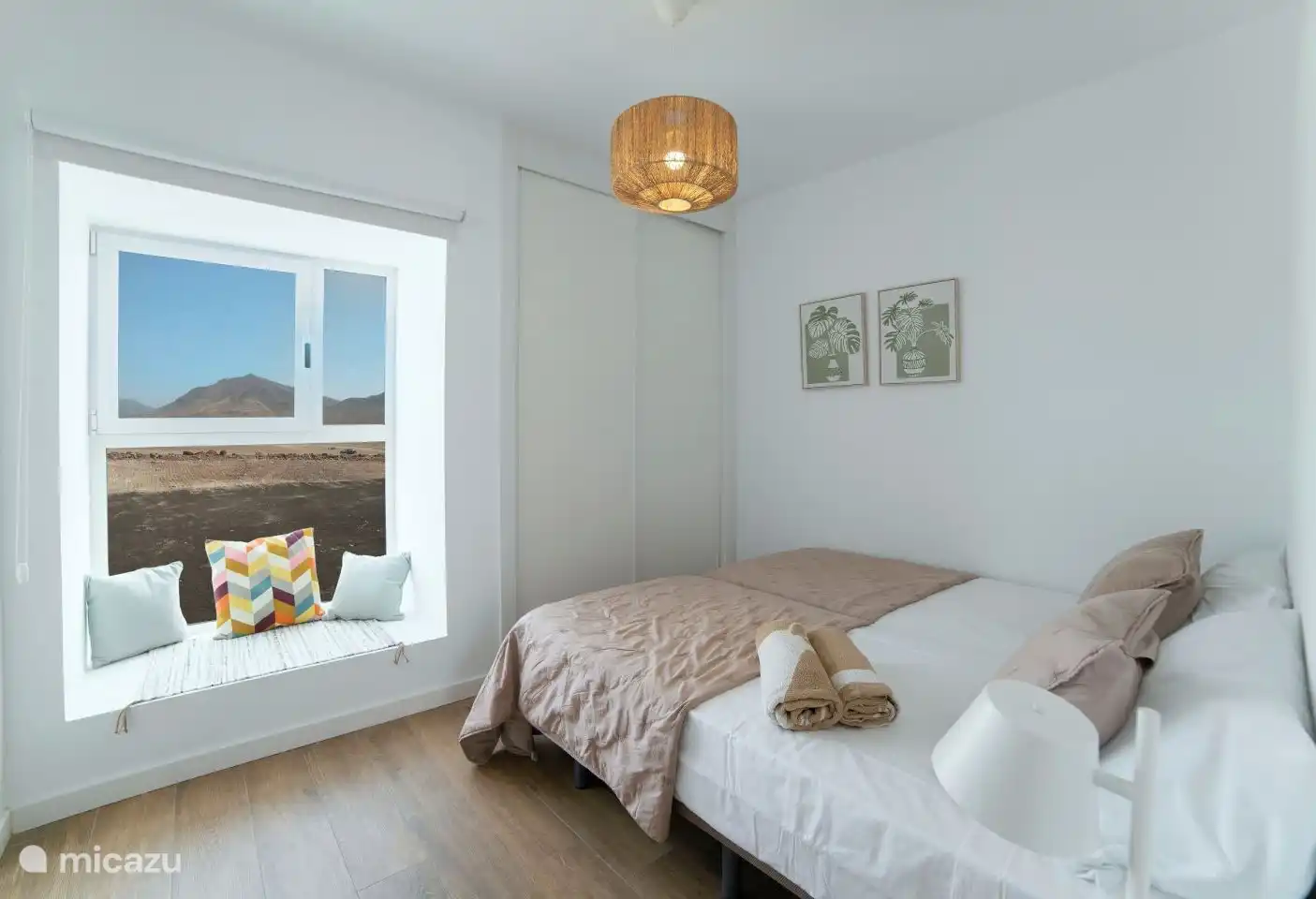 Bedroom 2 with two single beds and a view