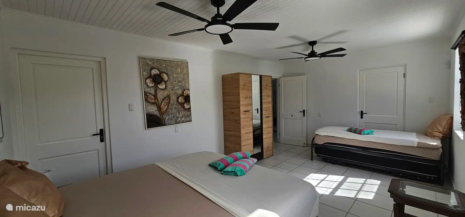 Bedroom3 upstairs. Sleeps 4 and pool view. 2 ceiling fans.