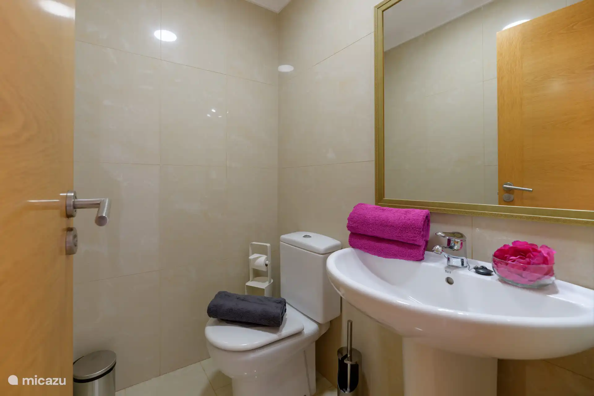 Bathroom 1 has a shower, toilet and sink.