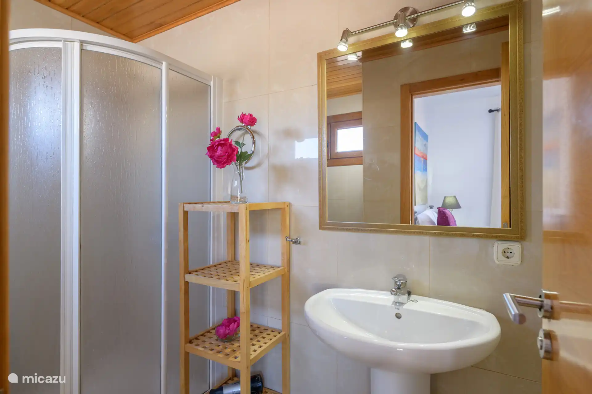 Bathroom with shower and sink