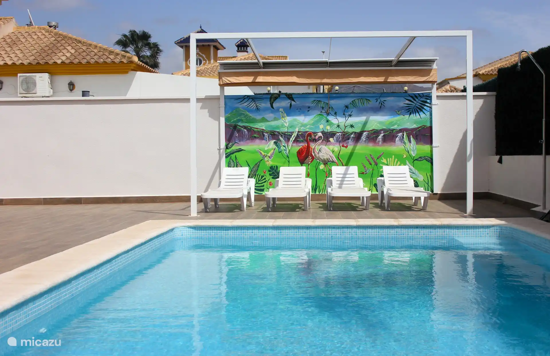 swimming pool with sunbeds
and shade cloth