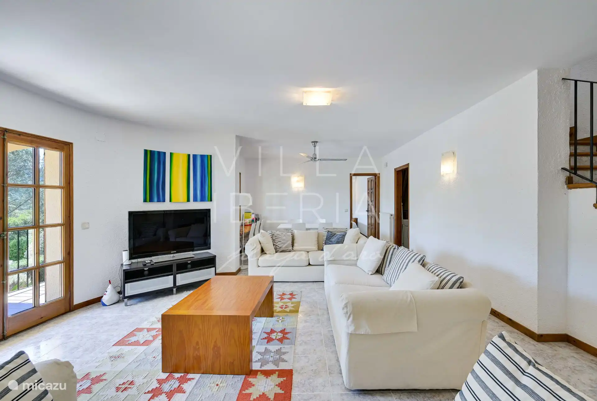 Living room, with another bedroom with ensuite bathroom at the end, there is also a space for the washing machine and a separate guest toilet