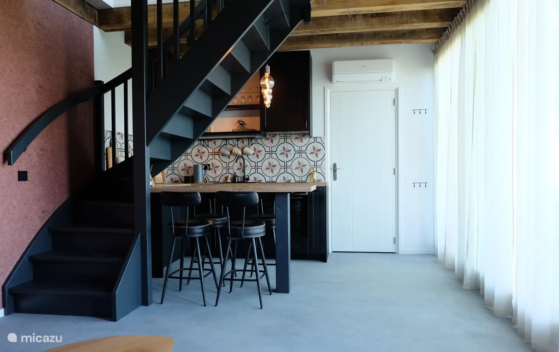 Kitchen and breakfast bar with stools
