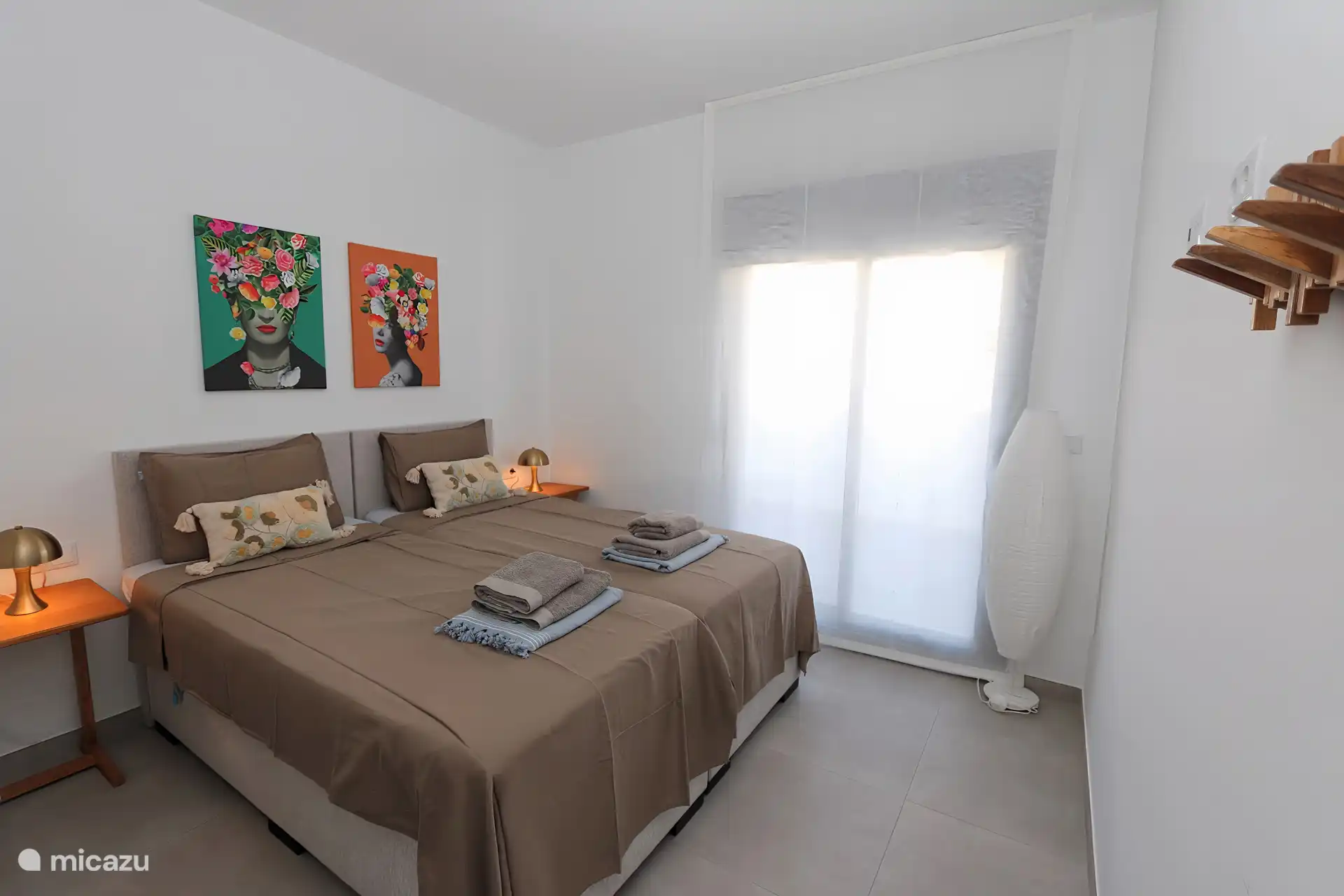 Second bedroom with two comfortable box spring beds.