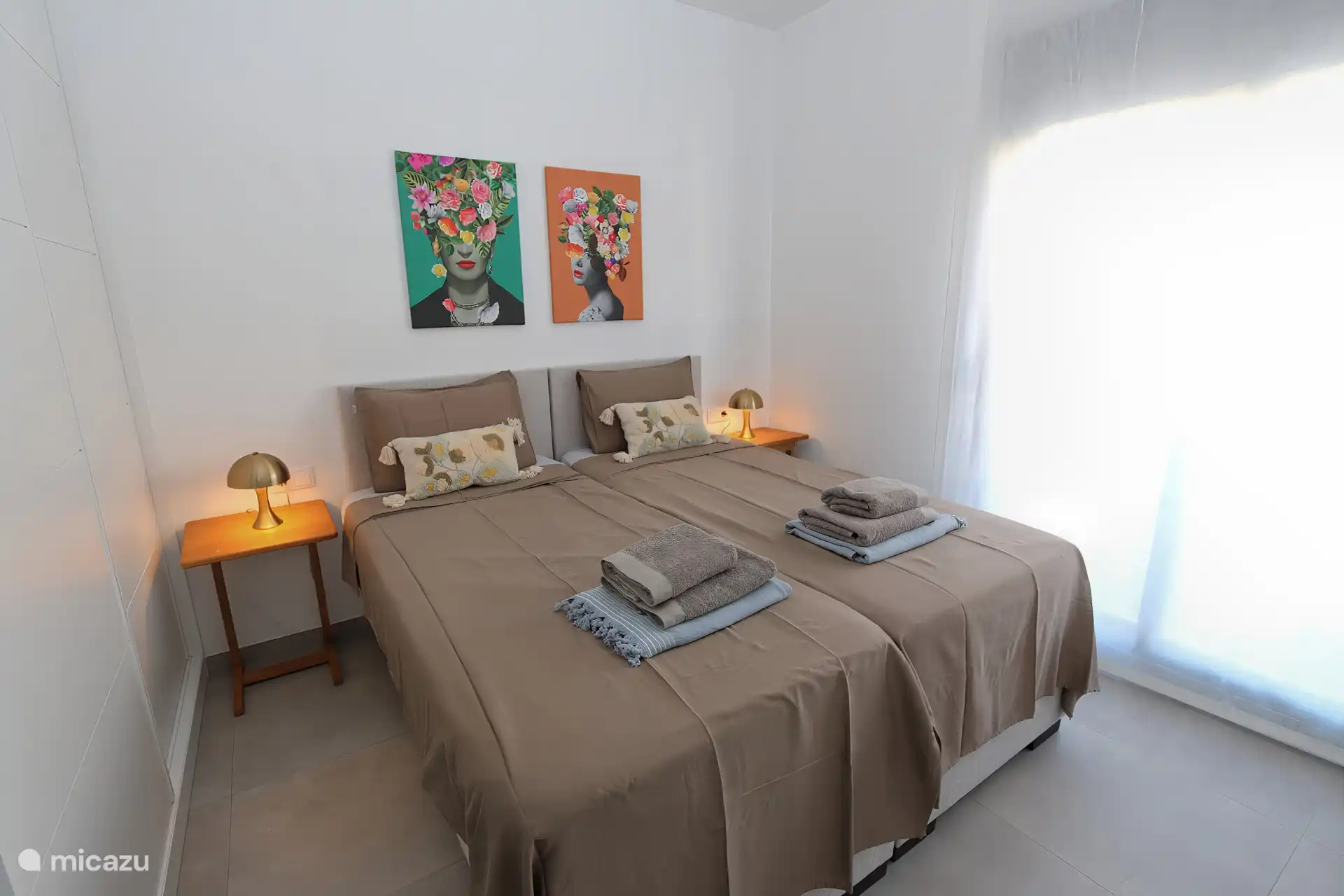 Second bedroom with two comfortable box spring beds.