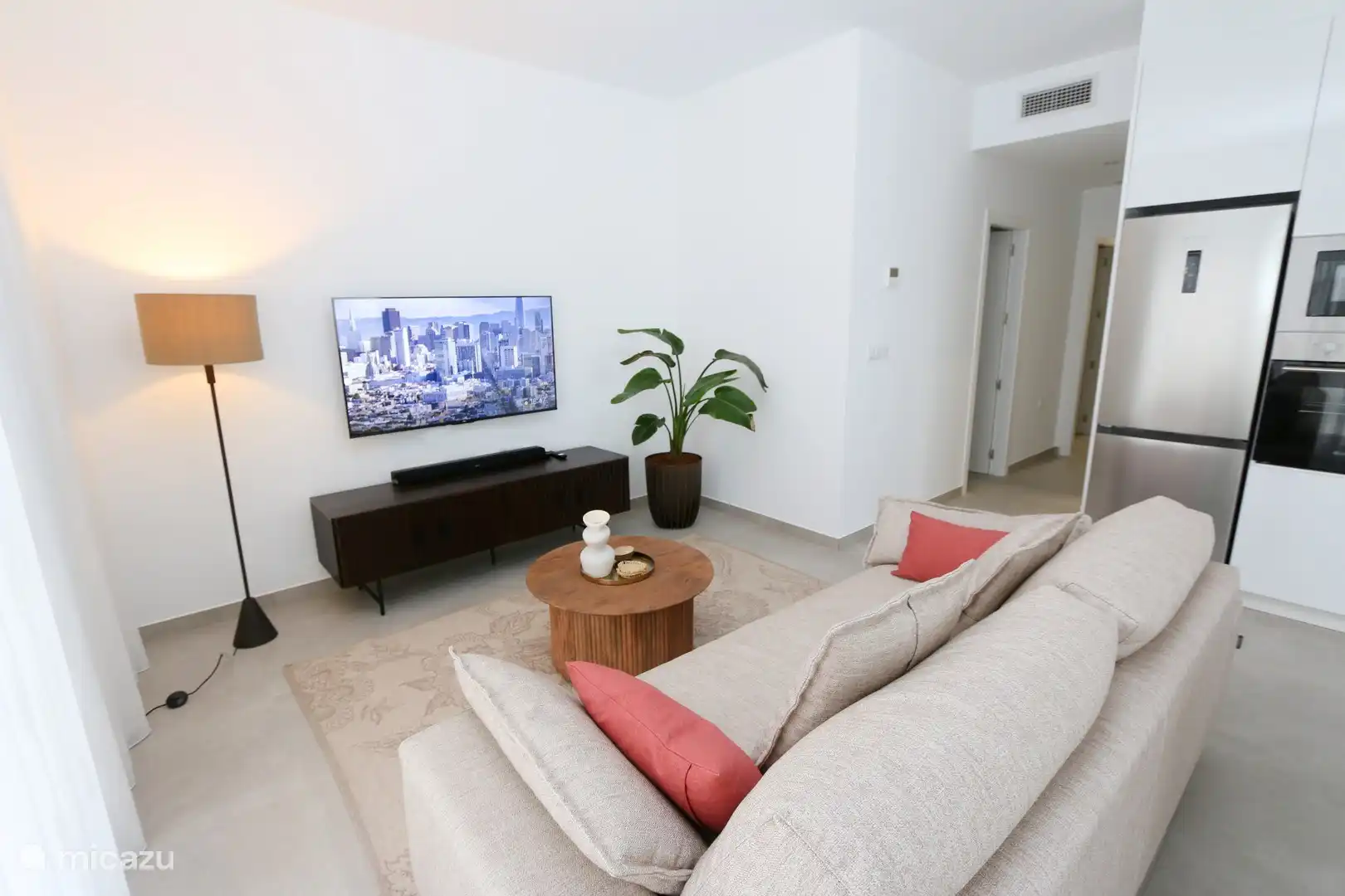 Comfortable sofa with a view of Smart TV