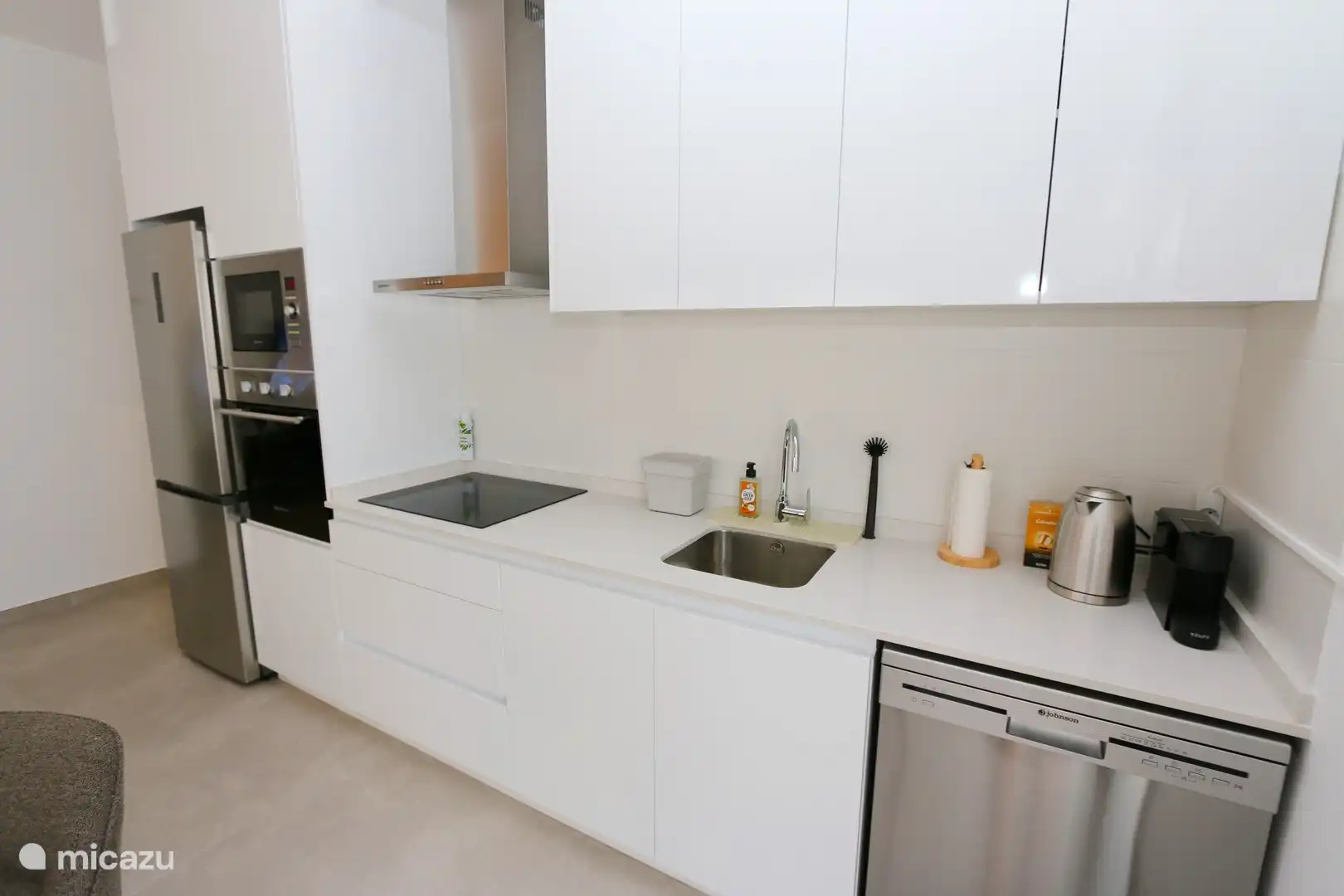 Modern kitchen with Nespresso, kettle and all necessary equipment.