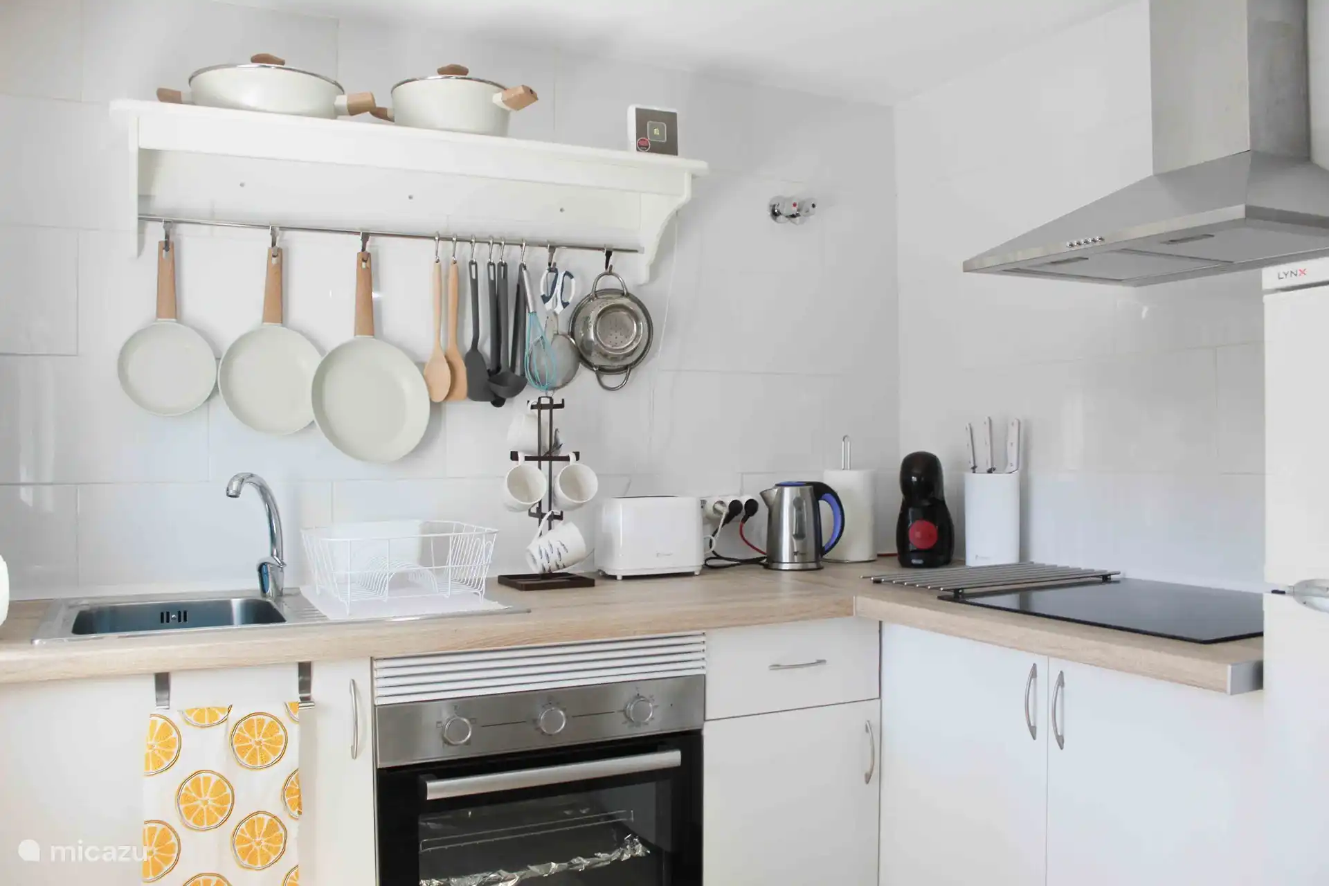 The kitchen is stocked with lots of appliances!
