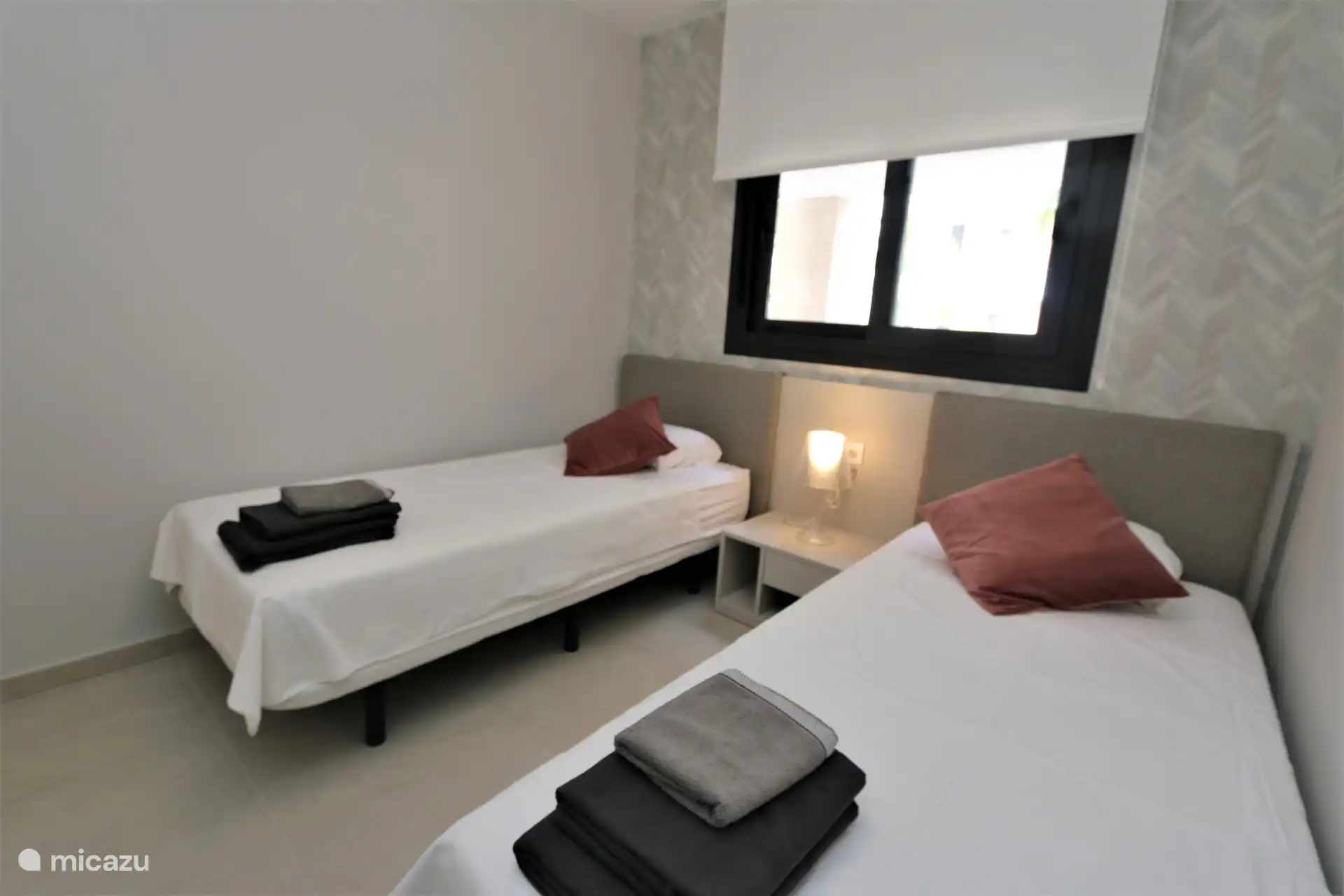 Chambre avec deux lits simples