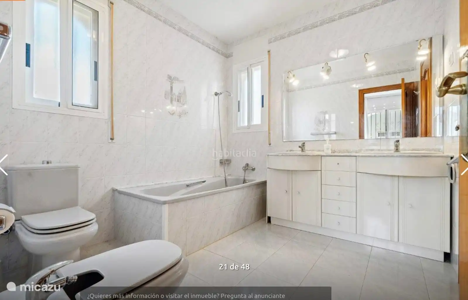 Spacious bathroom with bath, double sink, toilet and bidet. There is also a second bathroom with shower, toilet and washer/dryer.