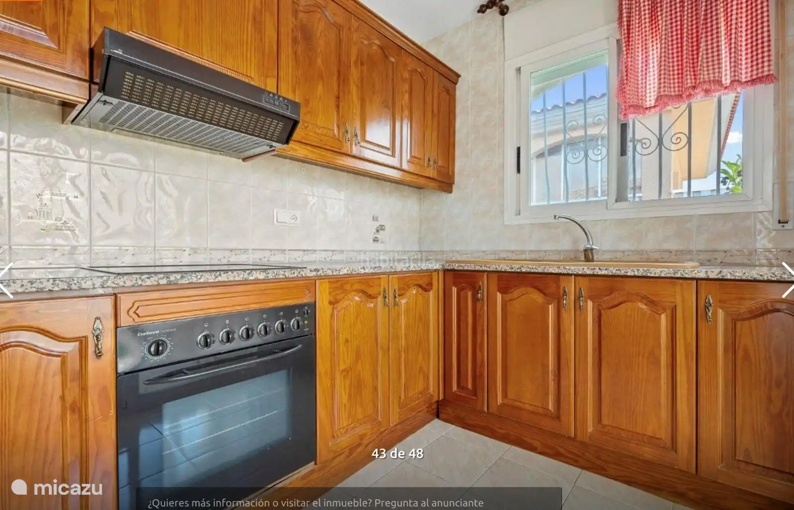 Kitchen with access to the bright conservatory and the large balcony/terrace. 