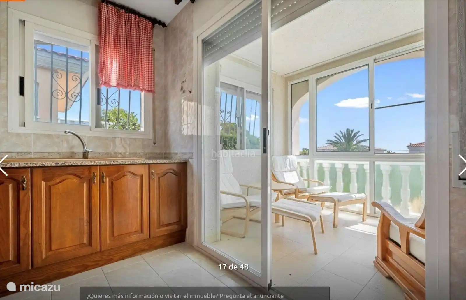 Cozy conservatory with sitting area.