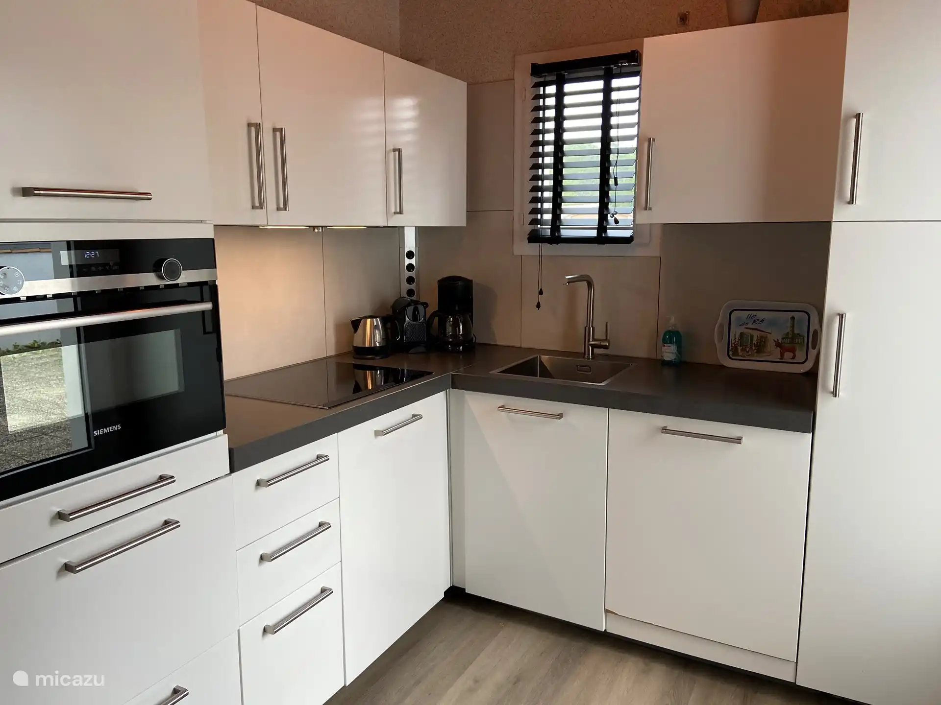 Kitchen with dishwasher and combi oven