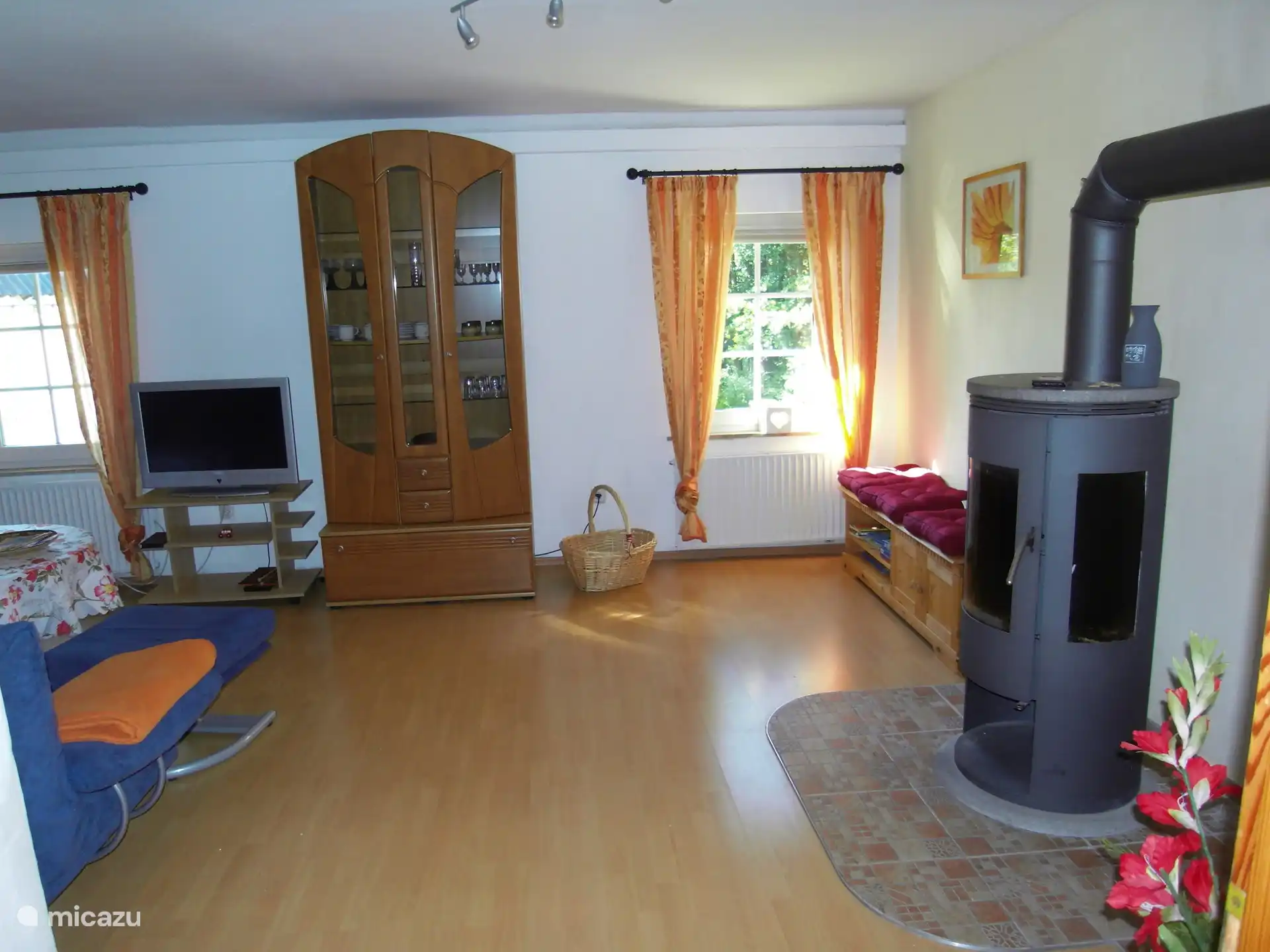 Living room with wood stove upstairs