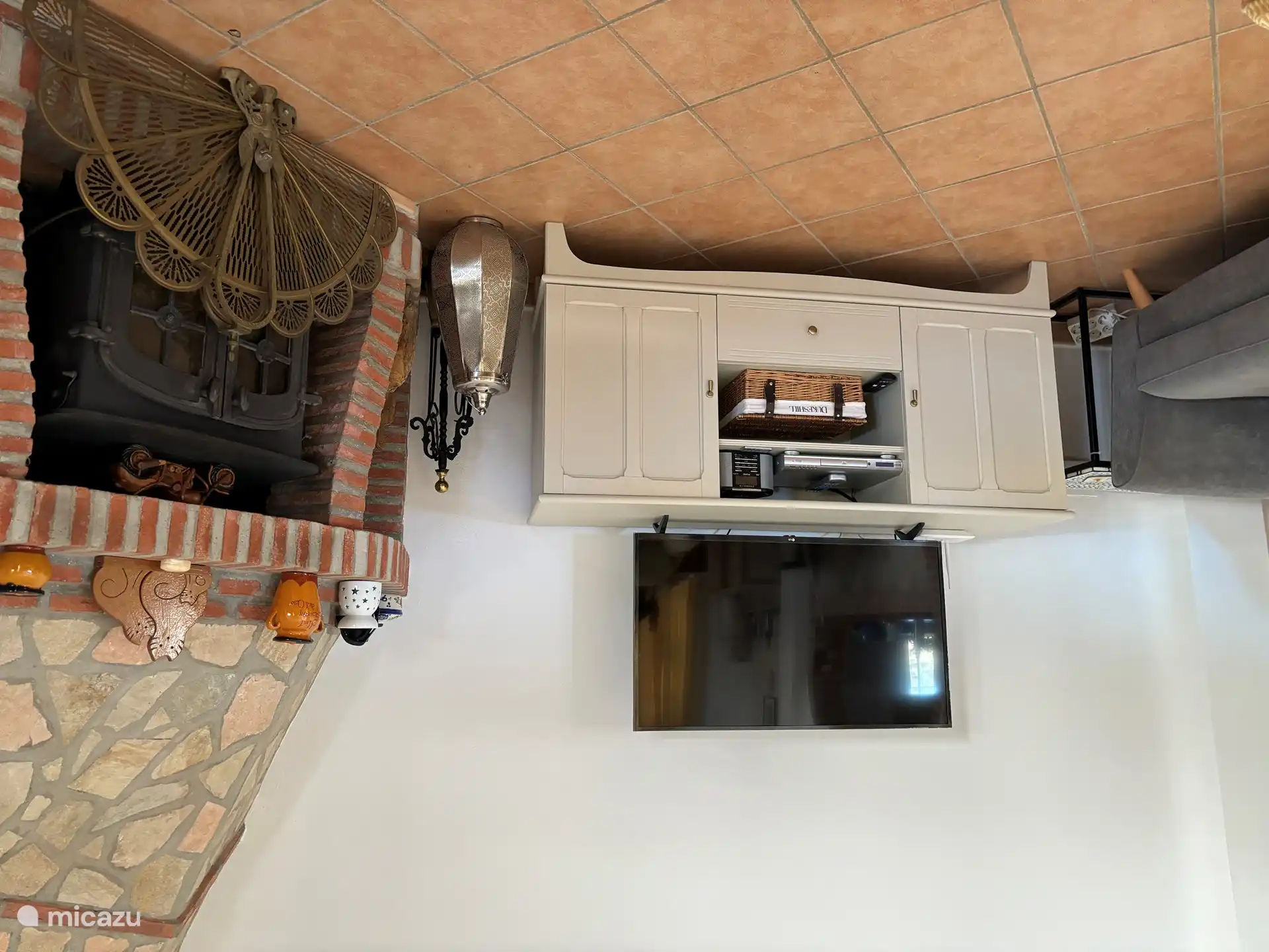 Living room TV and fireplace. 