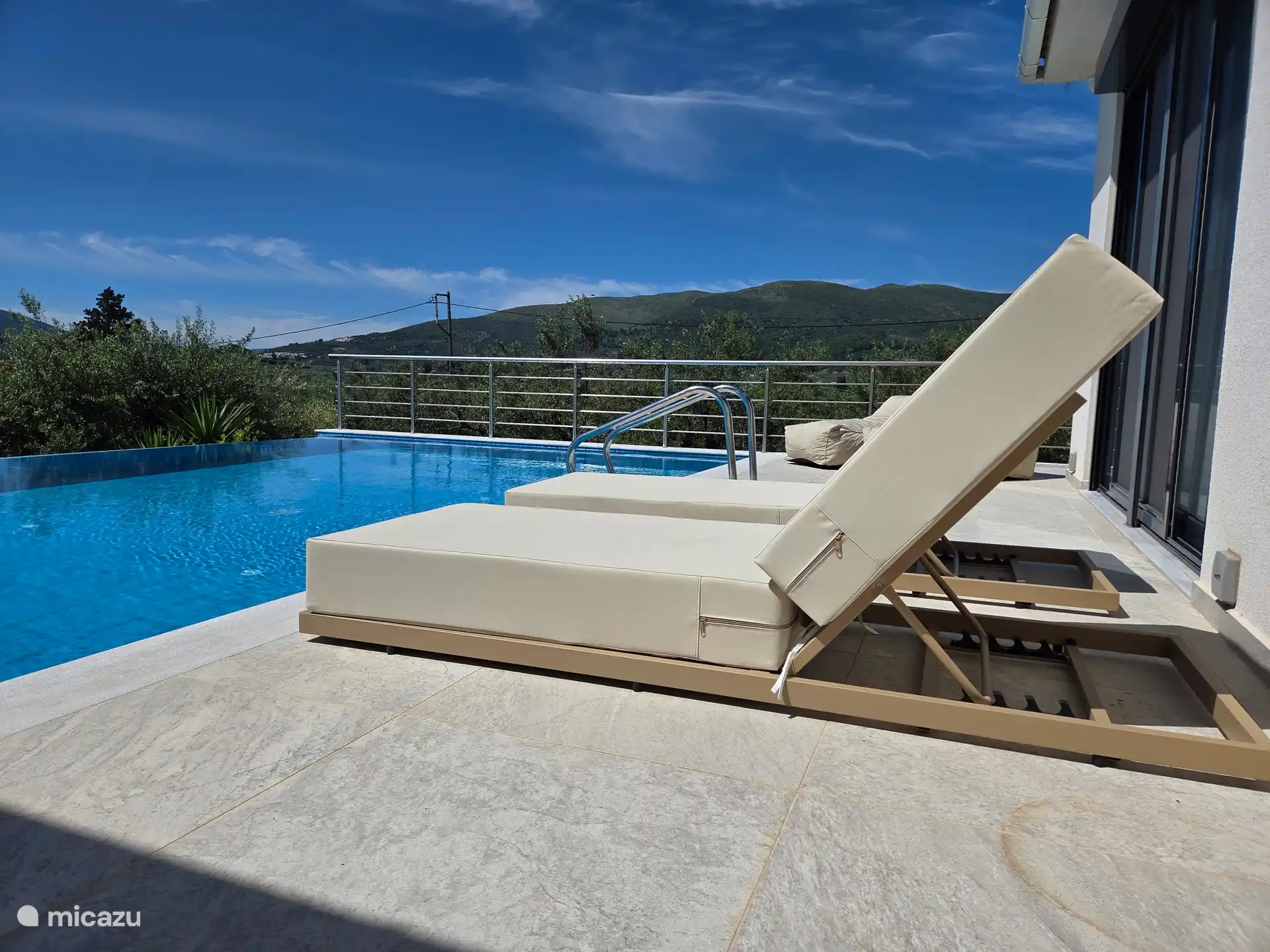 New sunbeds, sea and mountain views.