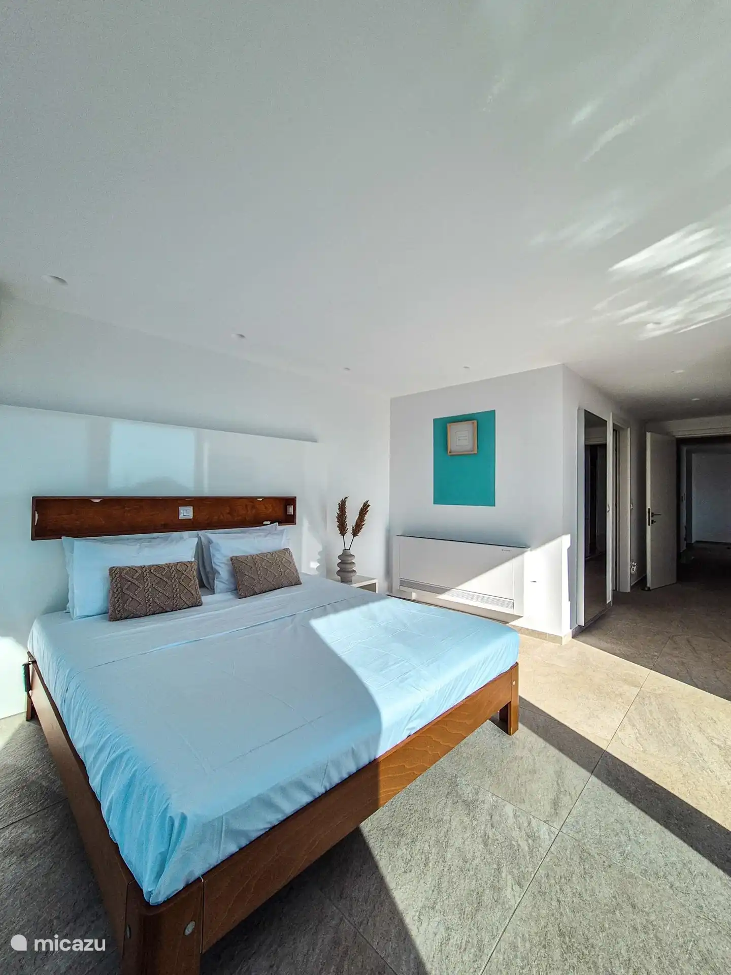 The master bedroom with an electrically adjustable bed from Auping. Waking up in a lovely bed with a great view!