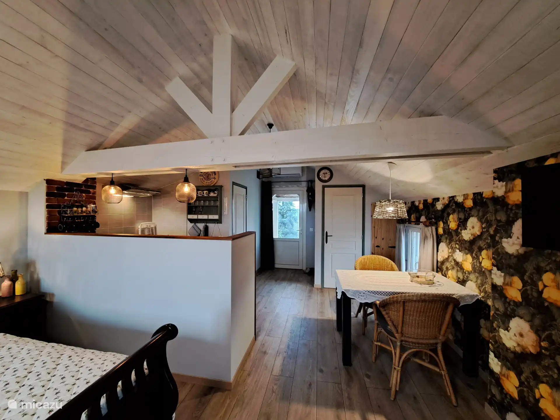 dining table viewed from the sitting area.
door to the toilet and the outside door.