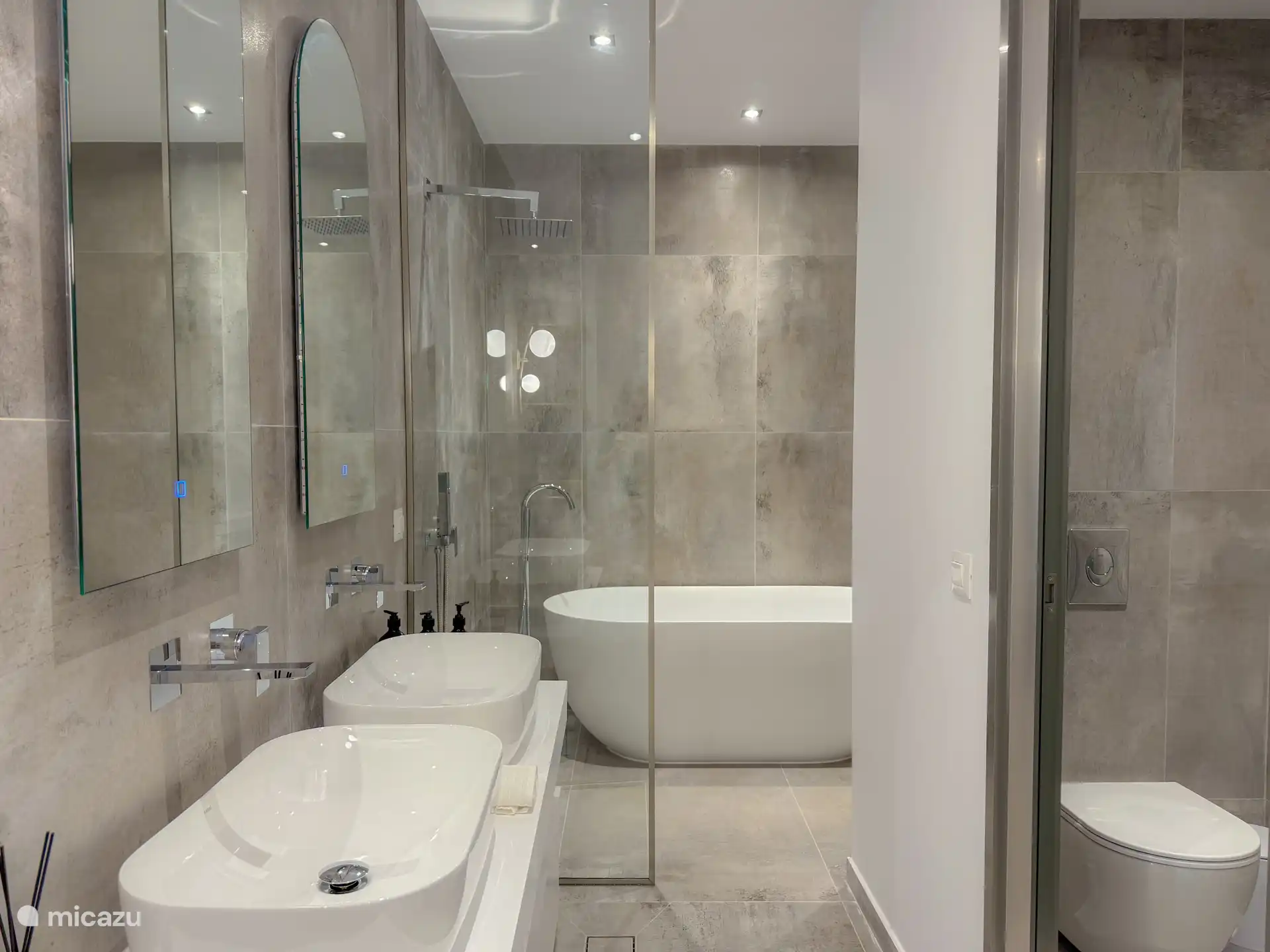 Master en-suite Bathroom. With 2 showers and a bath