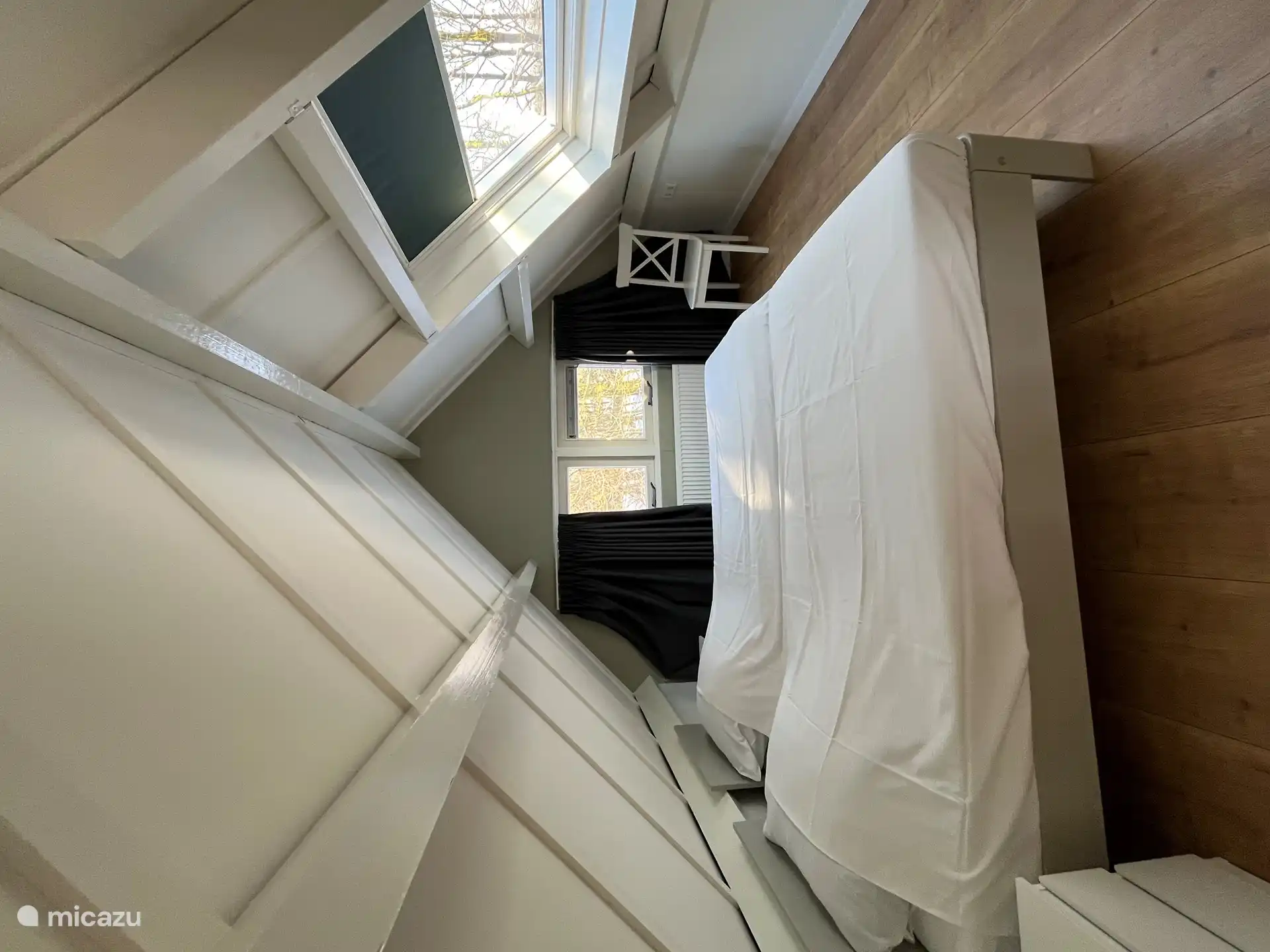 Bedroom on the first floor with 2 single beds (placed next to each other in this photo).