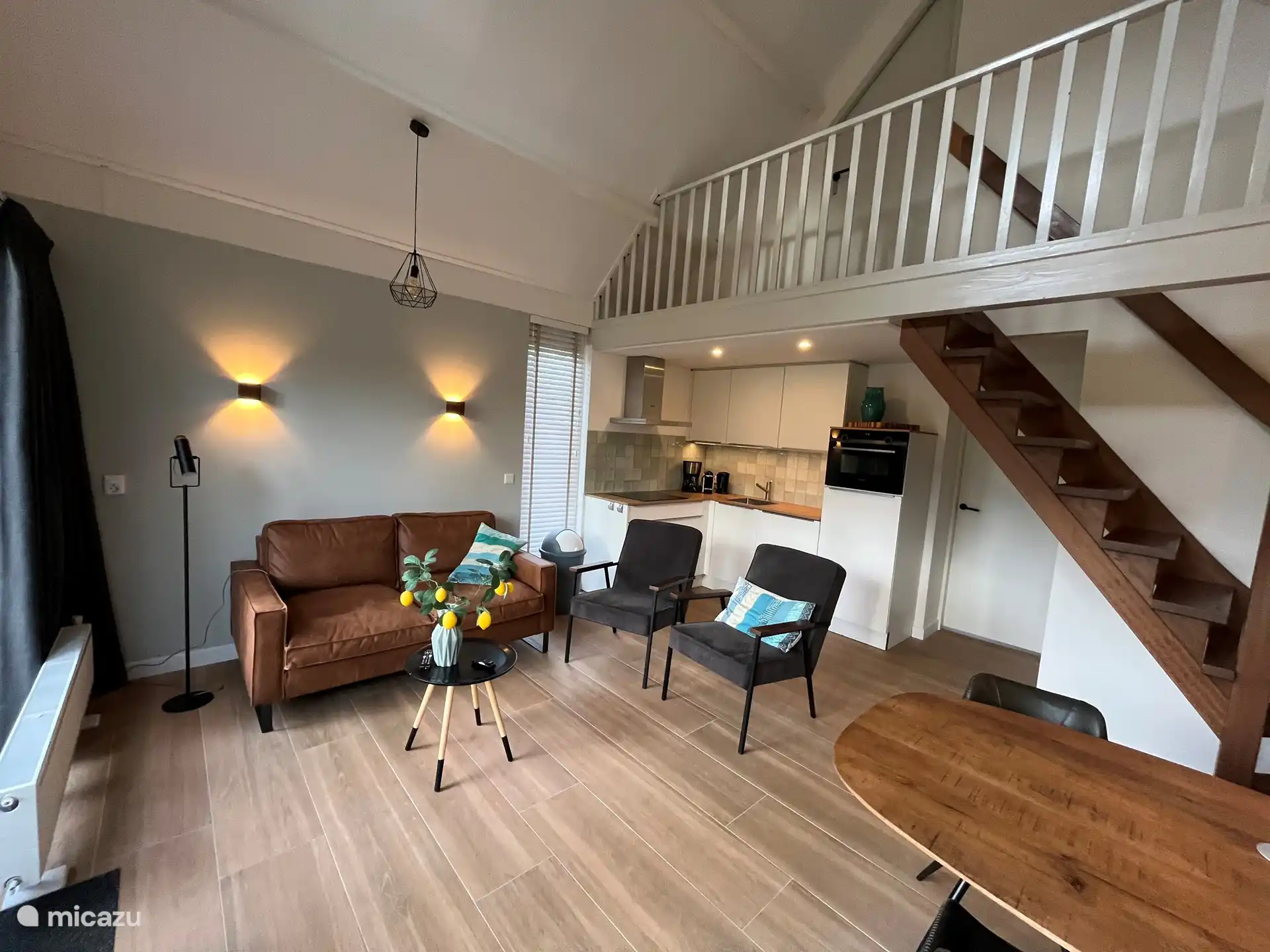 Cozy living room with mood lighting. Open kitchen. 