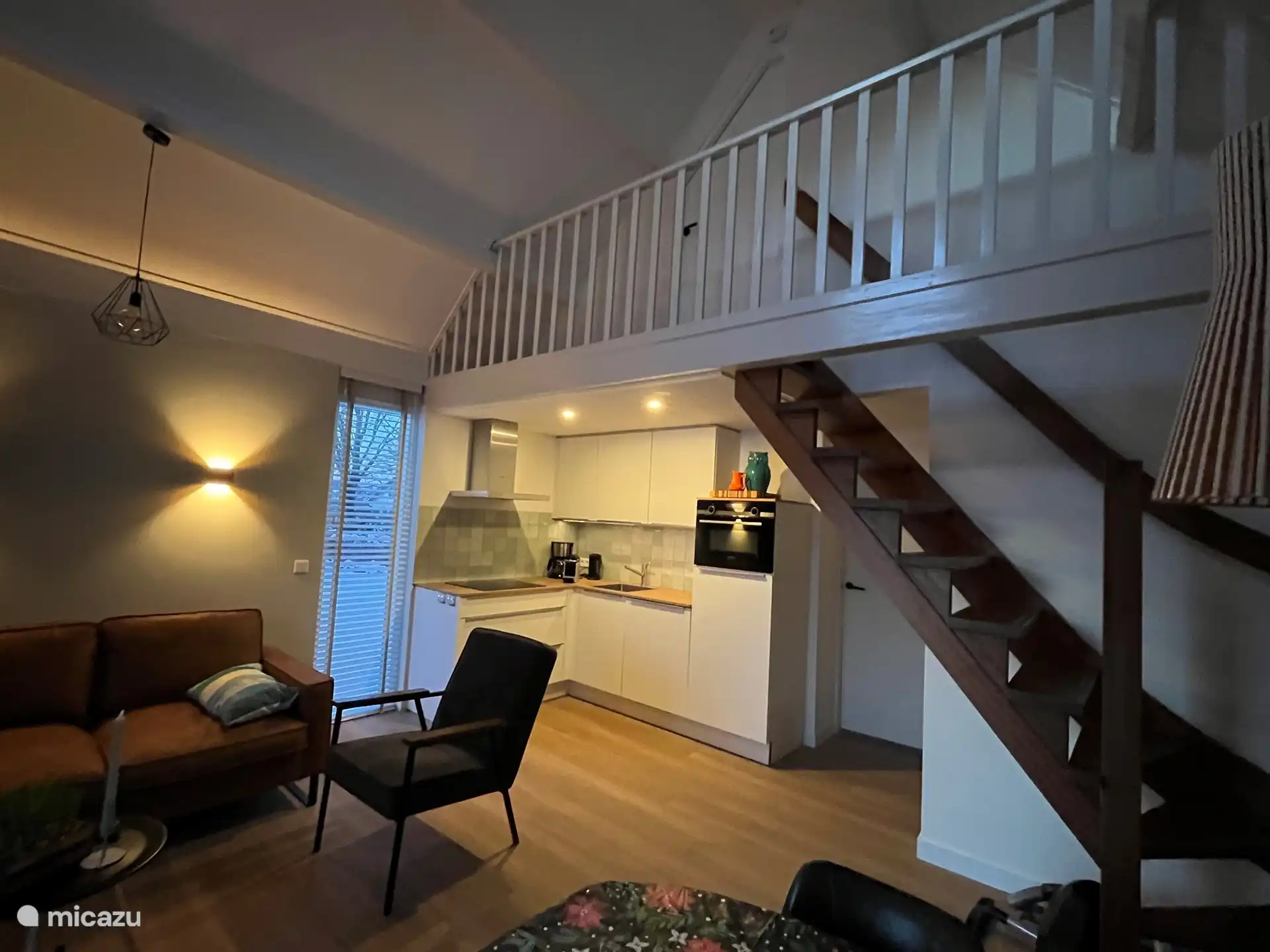 Cozy living room with a high ceiling.