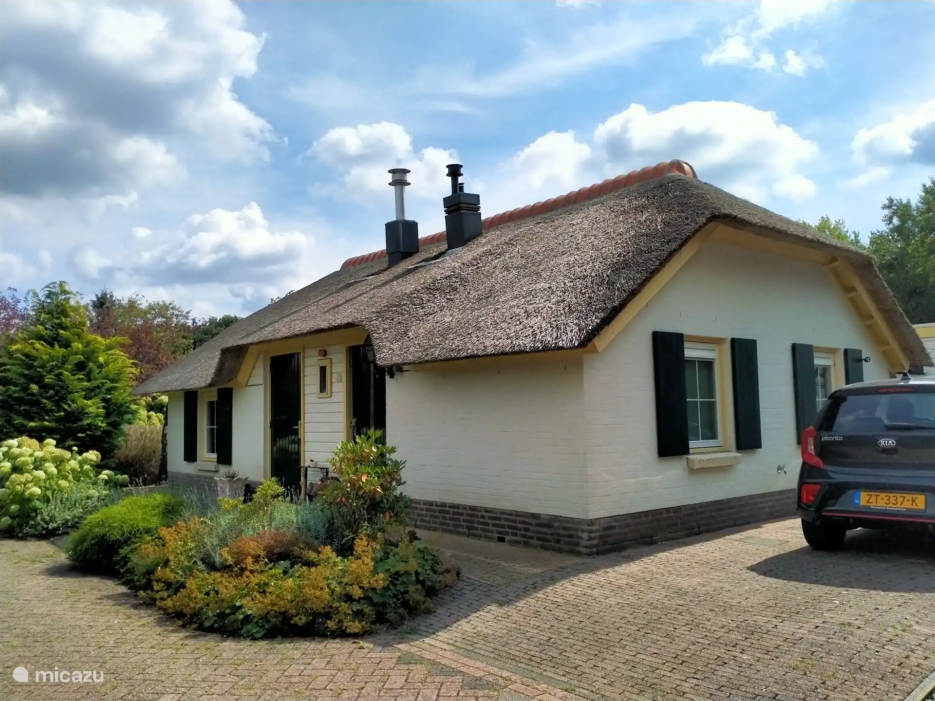 front of farmhouse next to farmhouse opportunity to park your car