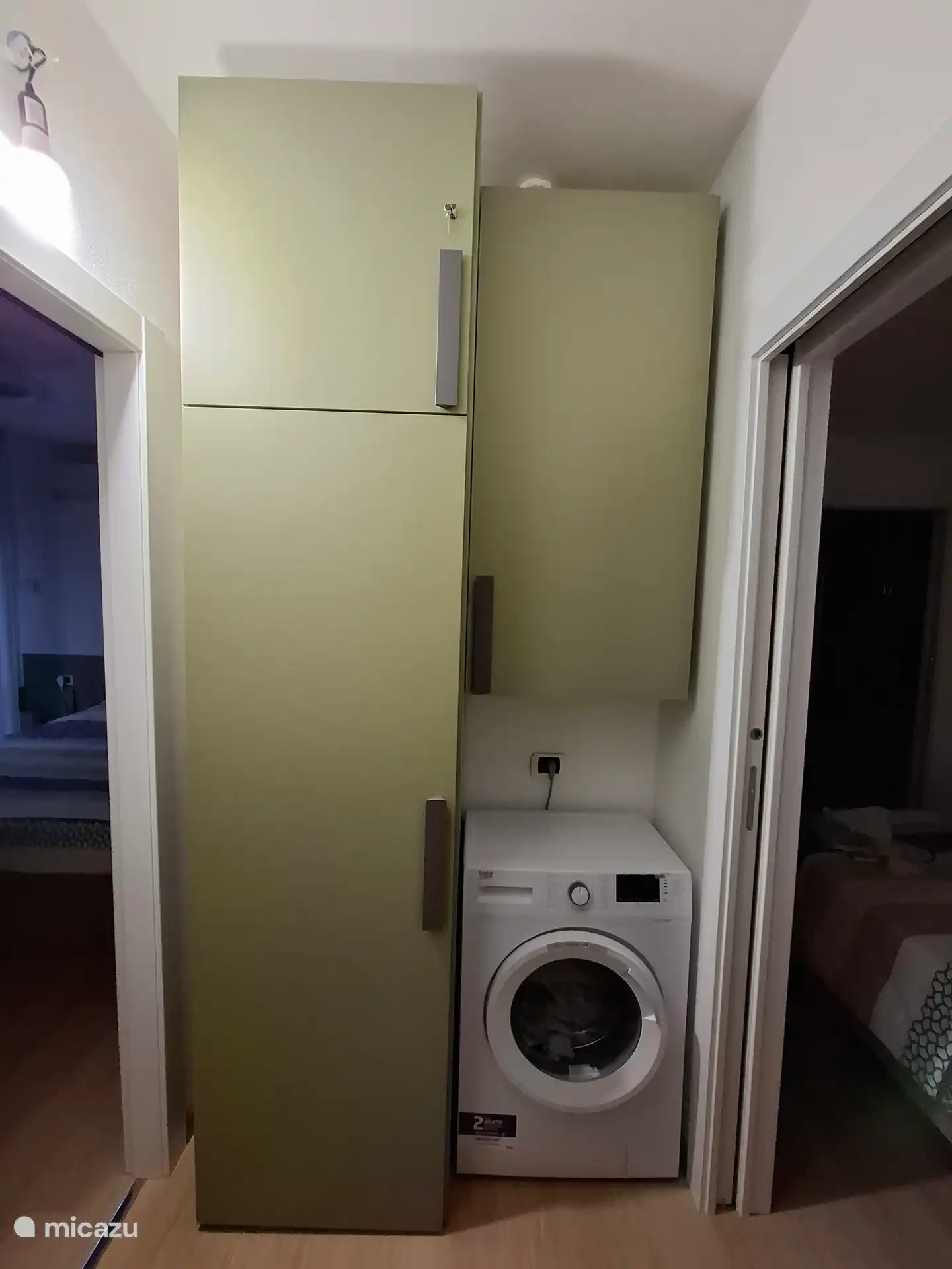 Cupboard wall with washing machine, drying racks available