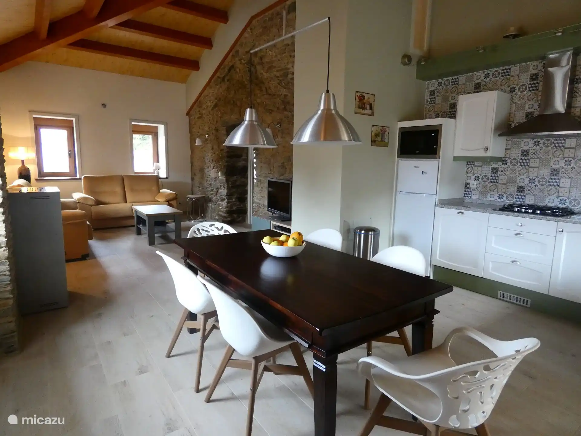 The cozy dining table, near the kitchen, so that everyone stays involved.