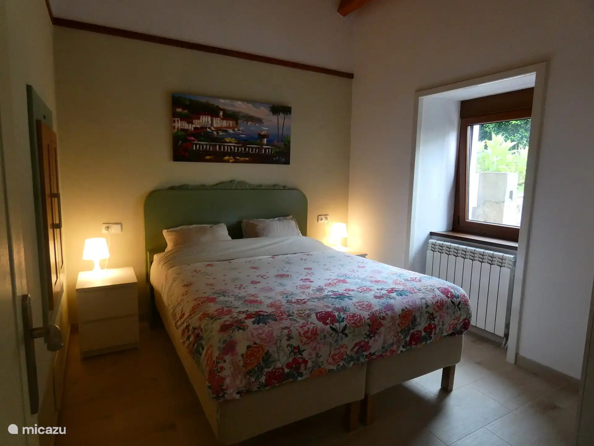 The comfortable rear bedroom with queen-size double bed