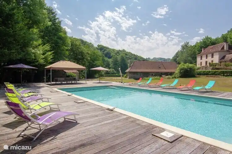 Swimming pool with 'La grande maison' and 'Le Moulin' in the background