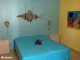 Spacious bedroom with large bed 180x210 cm, safe and ceiling fan