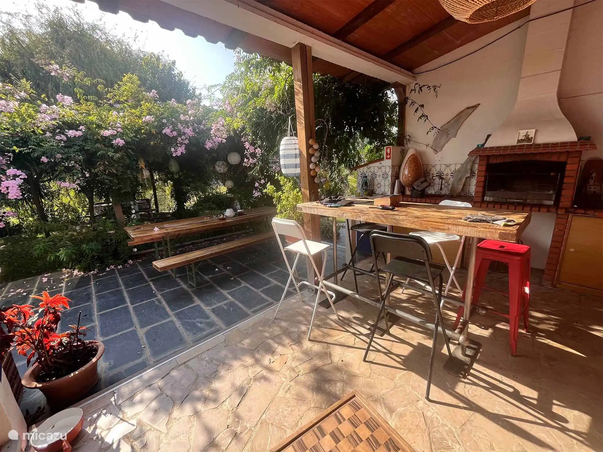 covered outdoor kitchen with BBQ