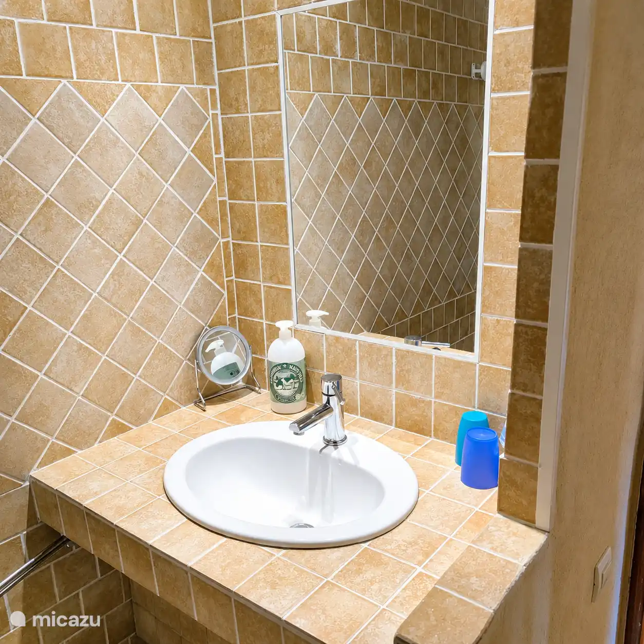 The sink is equipped with towel, soap.