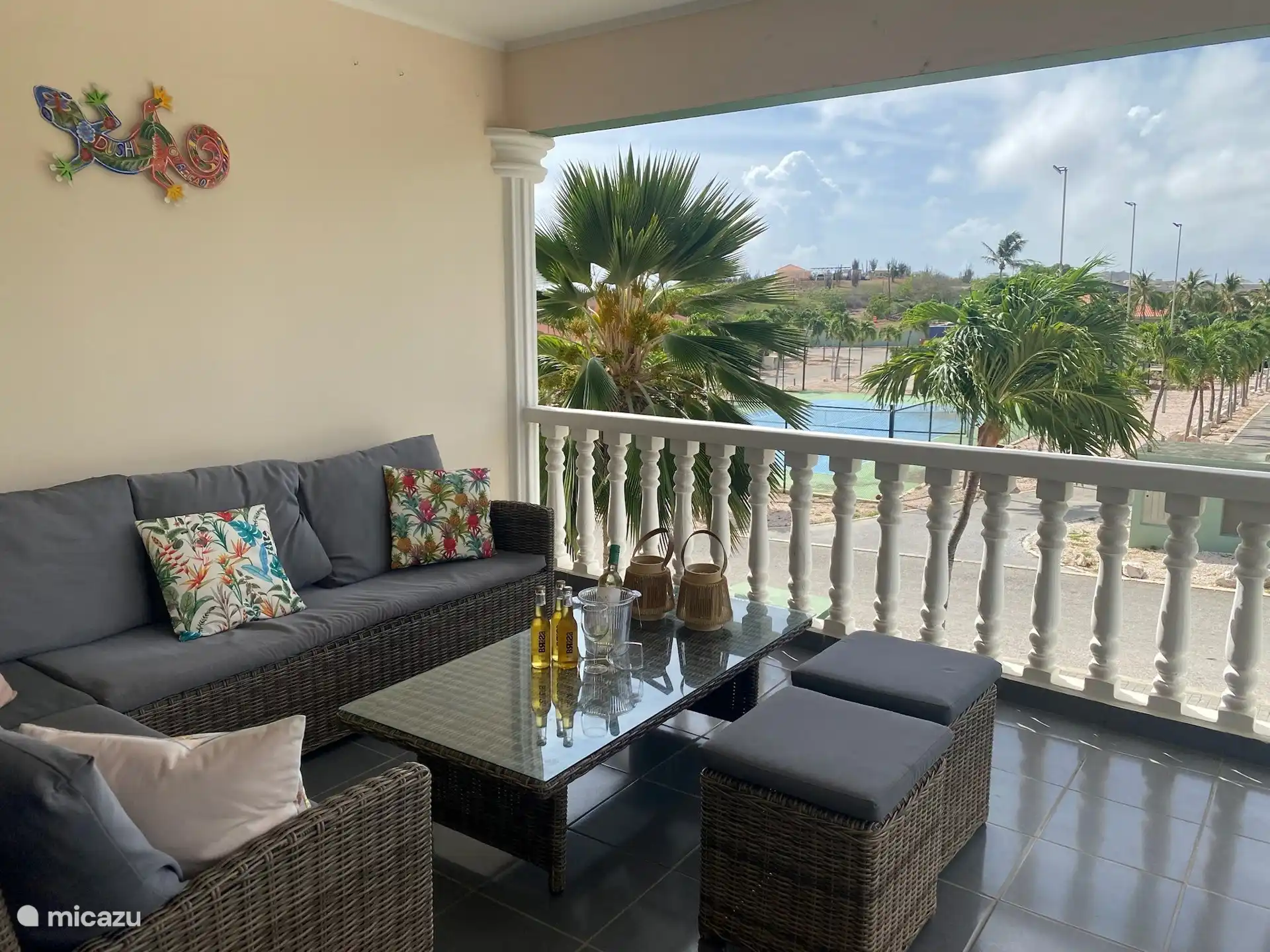 Spacious porch with comfortable lounge sofa and bistro table
