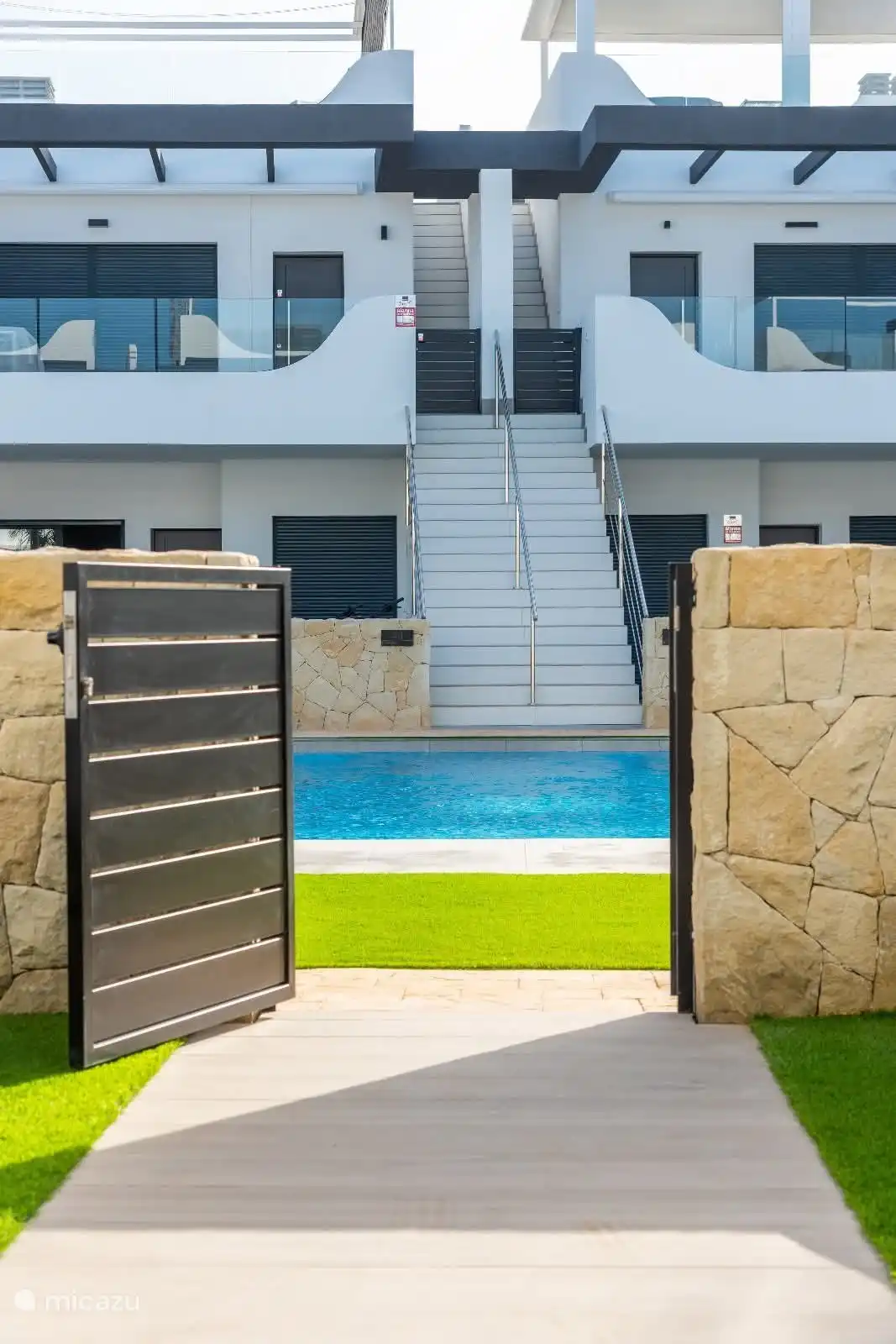 Access gate from terrace in front to swimming pool.