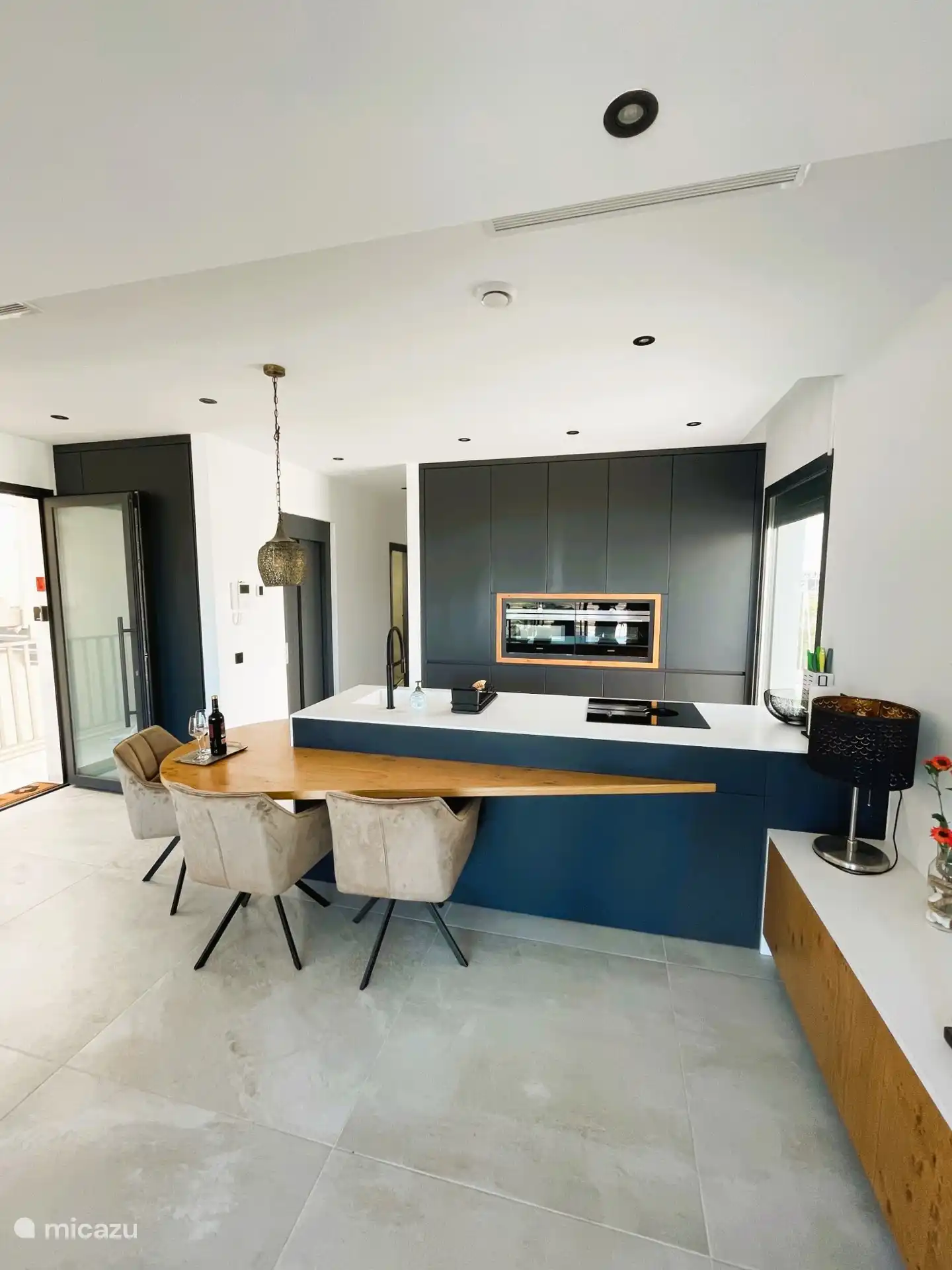 Luxury kitchen with LED lighting, large refrigerator and freezer, kitchen equipment 