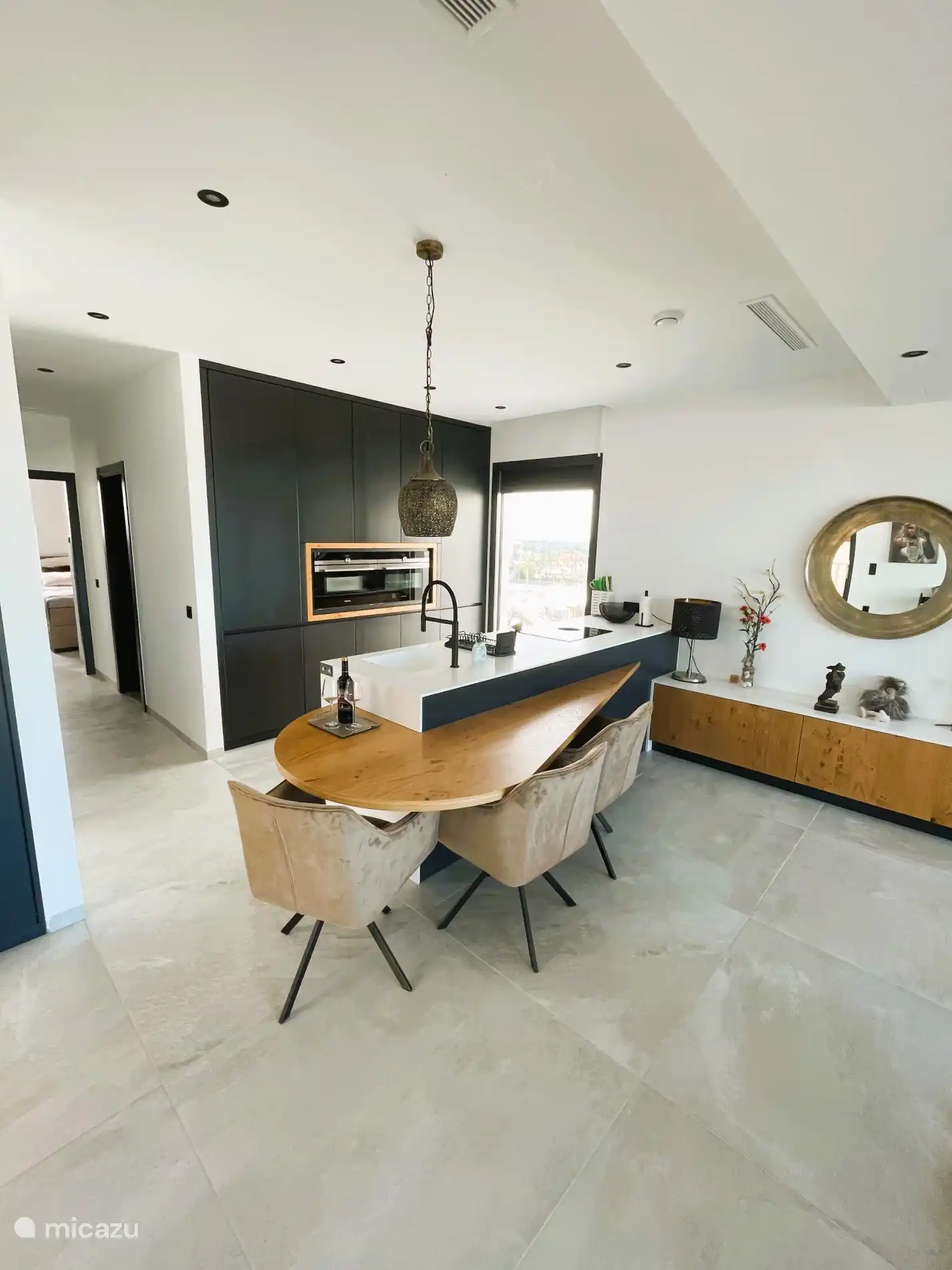 State-of-the-art kitchen with all amenities such as an oven and microwave, a dishwasher, Nespresso machine, kettle and all basic necessities