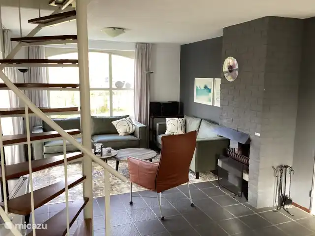 Parque de vacaciones de Krim. 724. en Países Bajos, Texel, De Cocksdorp - casa vacacional Salón comedor con chimenea.