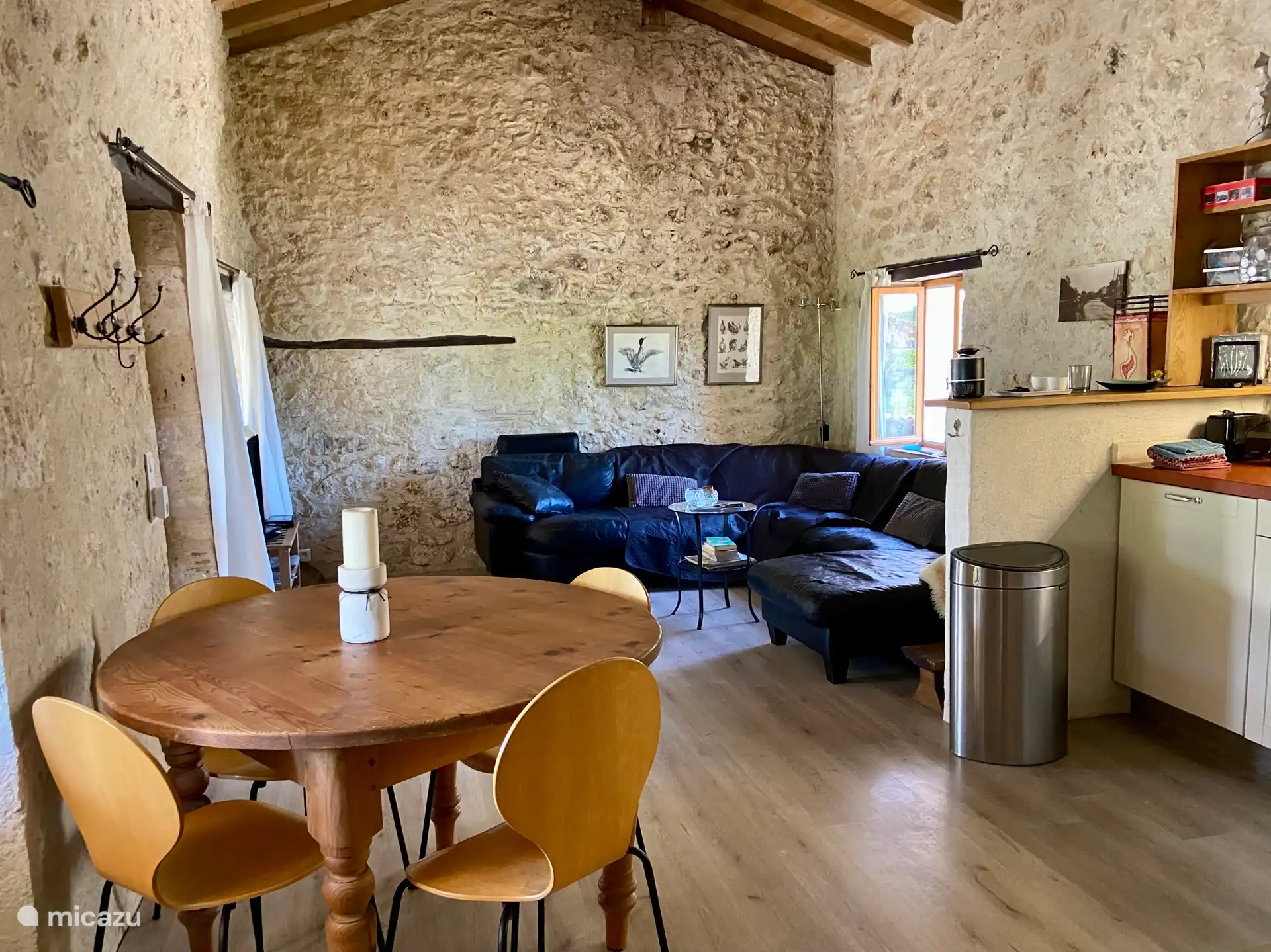 Living room with sofa and open kitchen