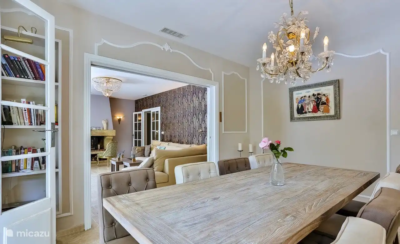 dining room inside with a view of the living room