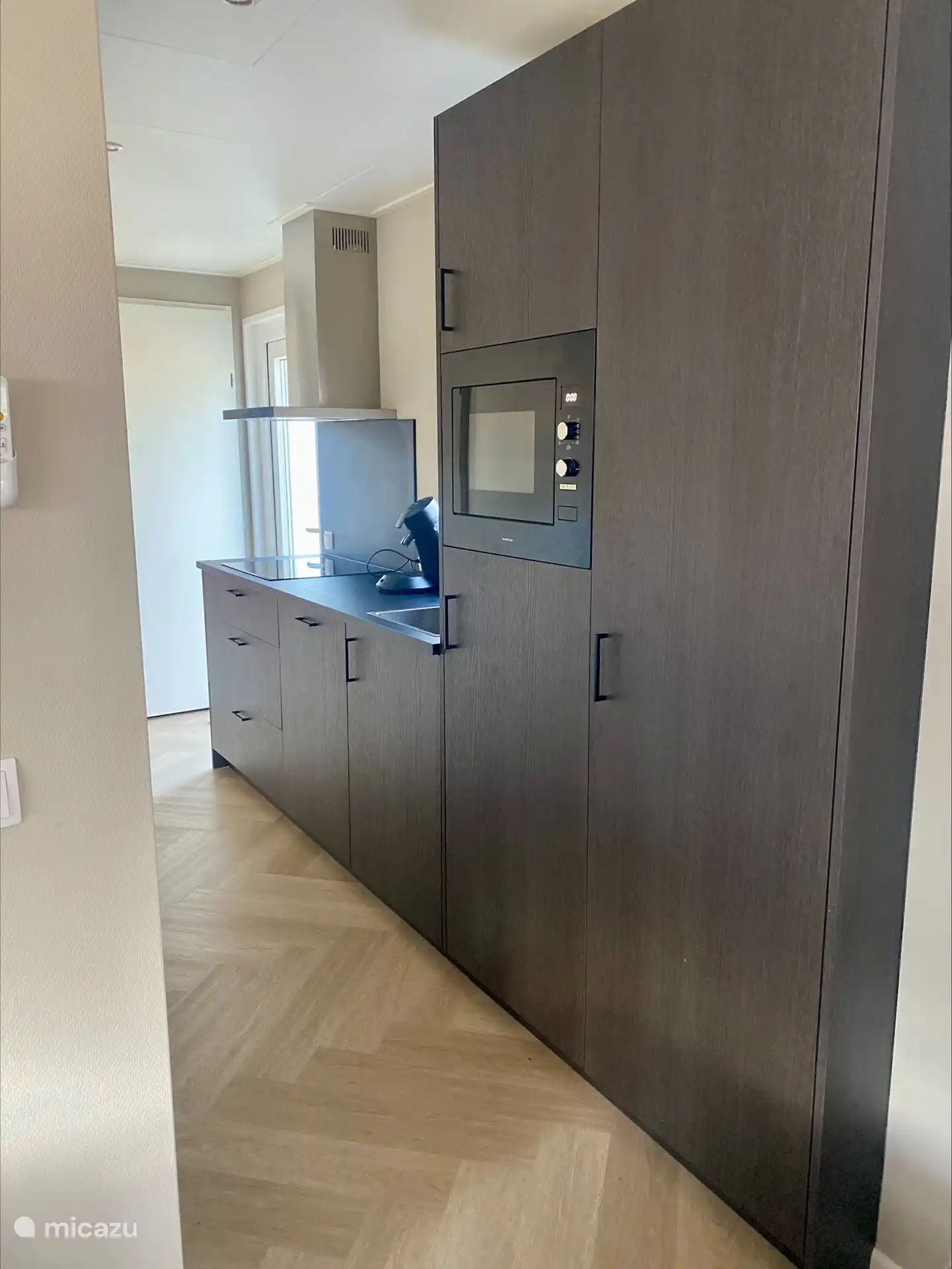 the kitchen with dishwasher, combi oven, fridge and freezer and all necessities