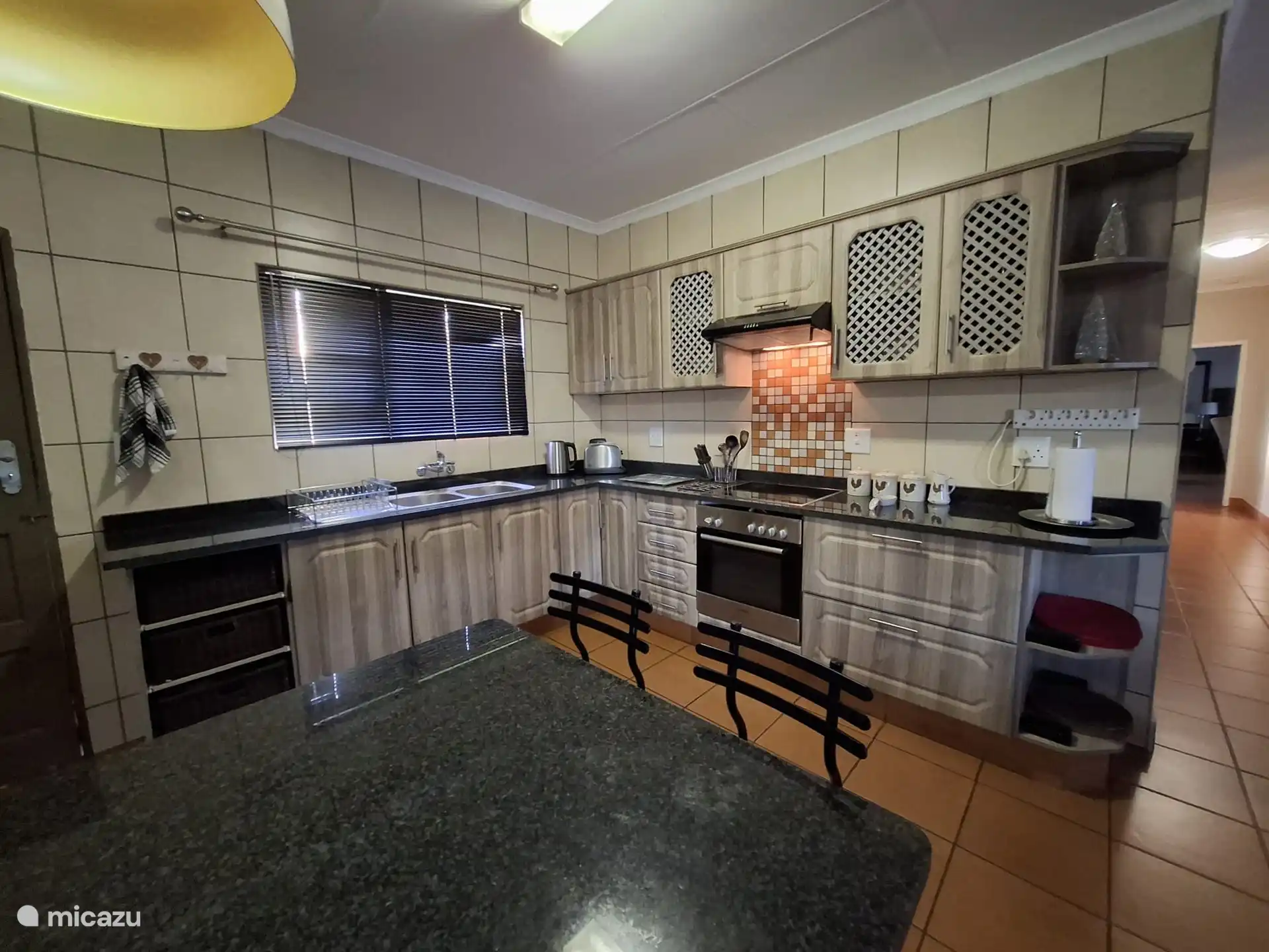 Large kitchen with stove and oven.