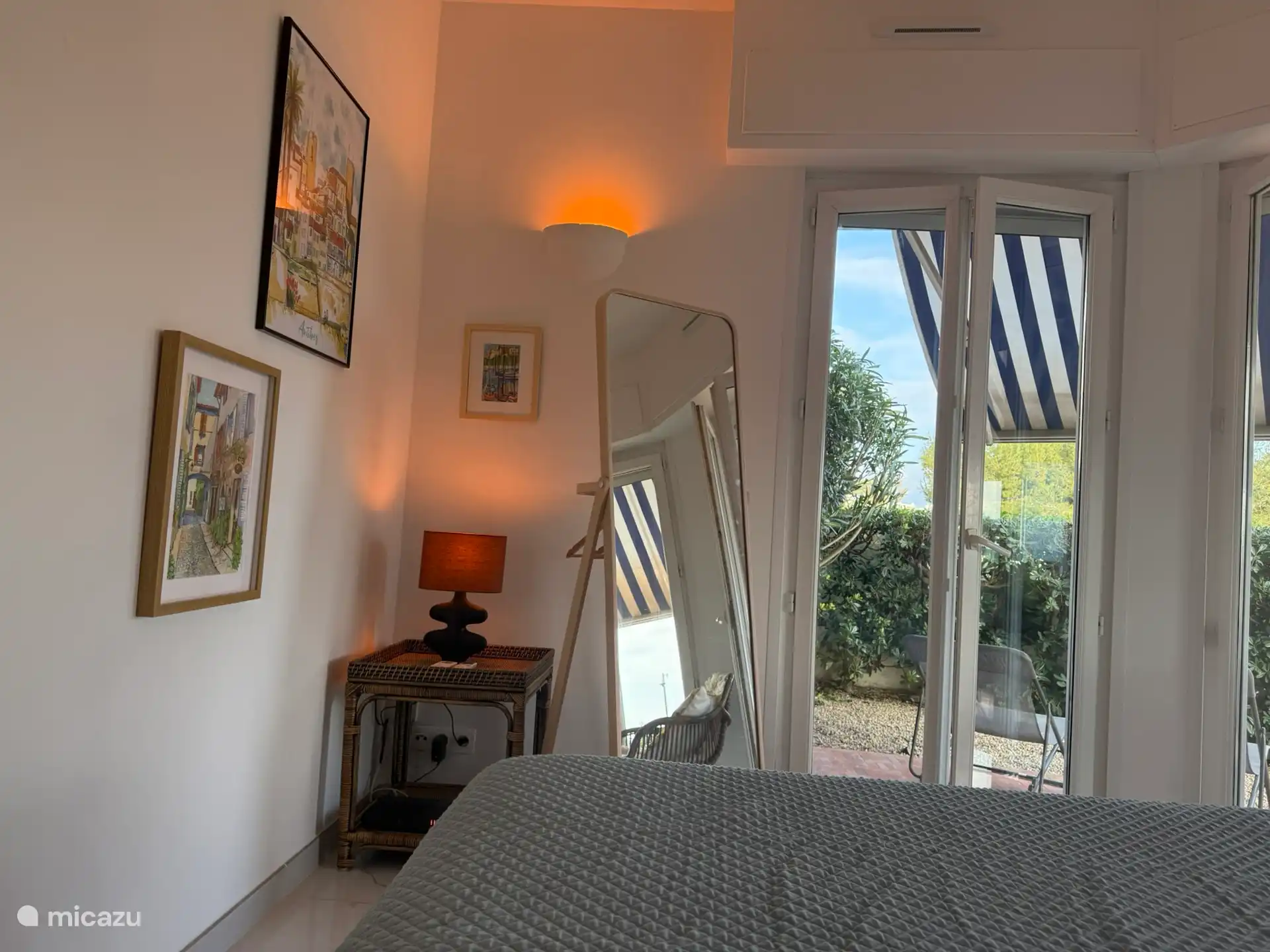 Master bedroom with patio doors to the terrace and garden