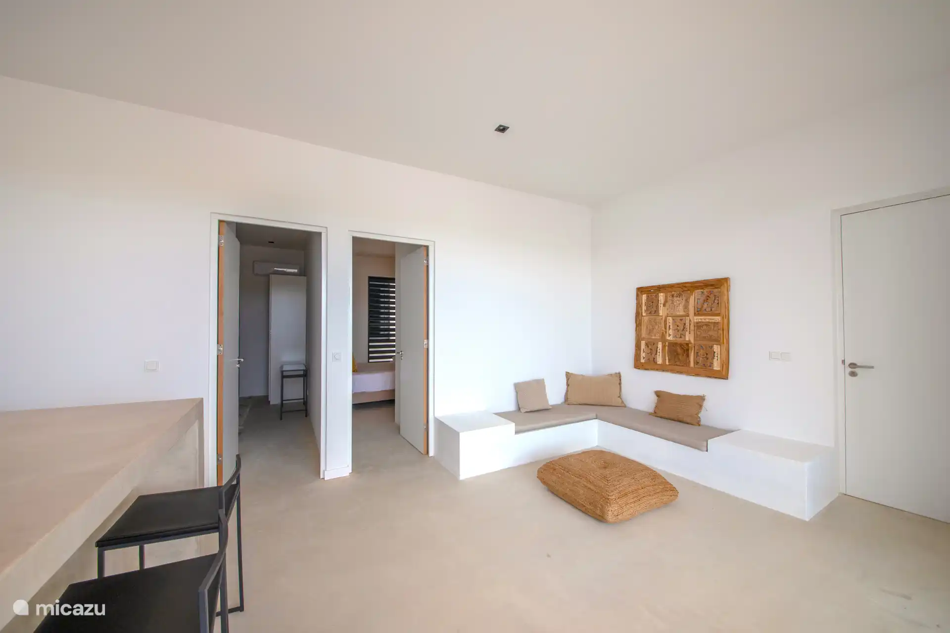 Living room with seating and open kitchen