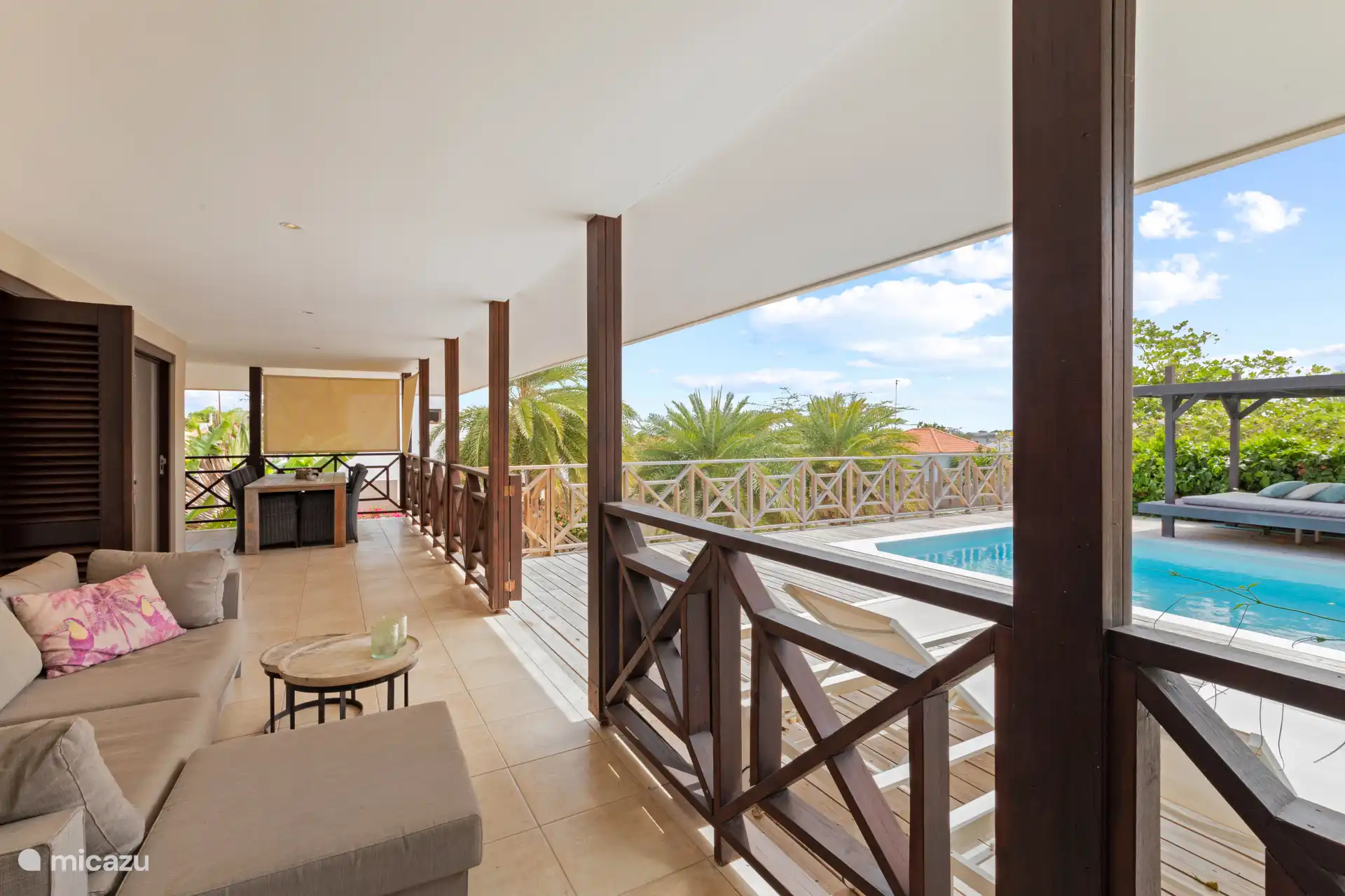 You can also enjoy the evening on your covered terrace with a view of the pool