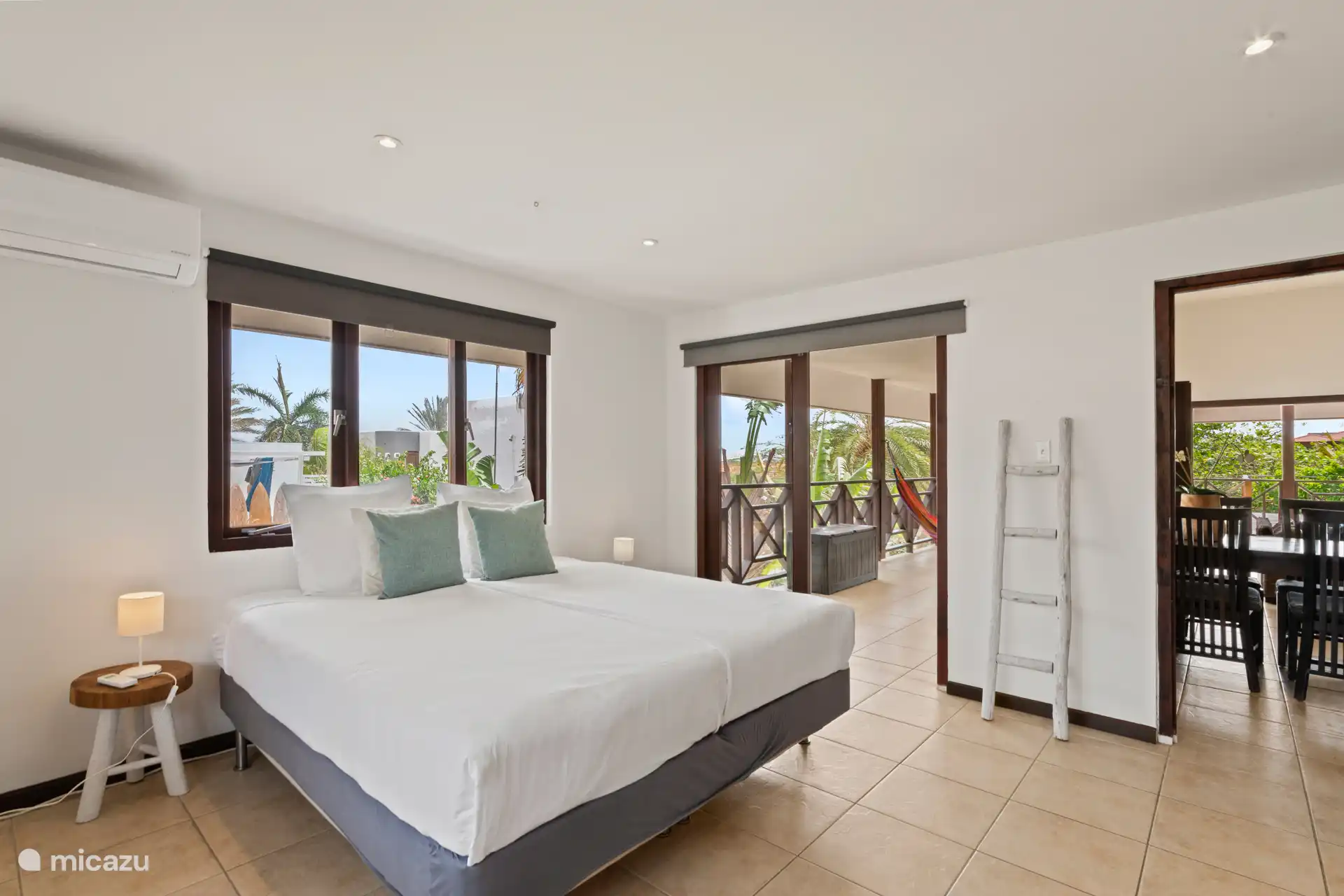 Bedroom with air conditioning and patio doors to terrace