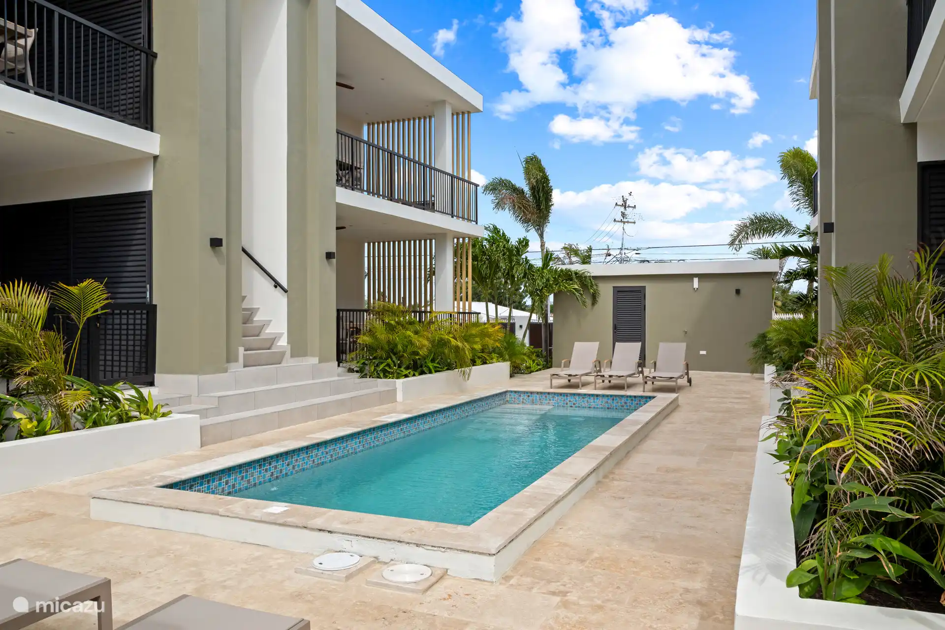 Sun beds by the pool.