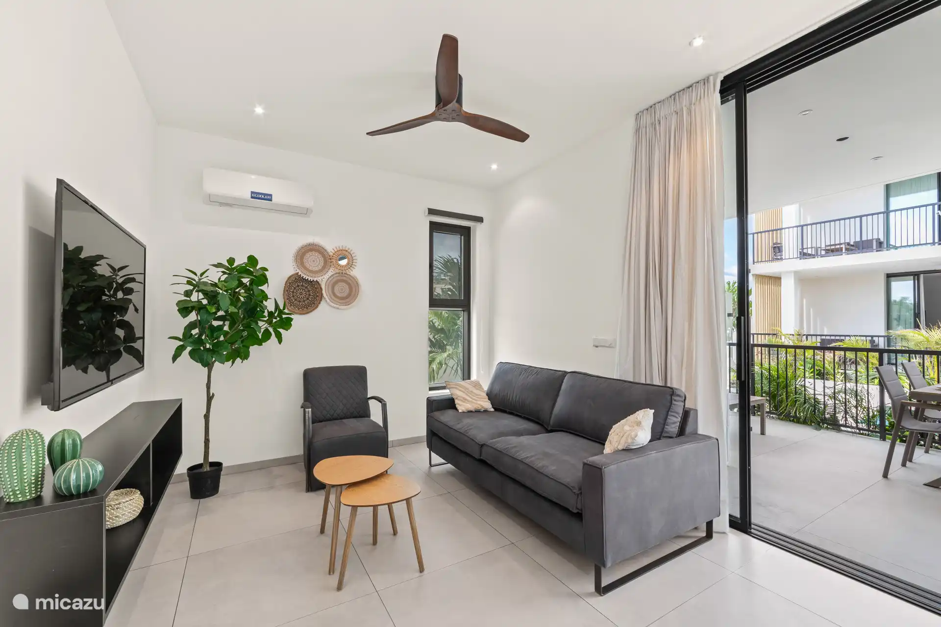 Living room with air conditioning, sitting area, television