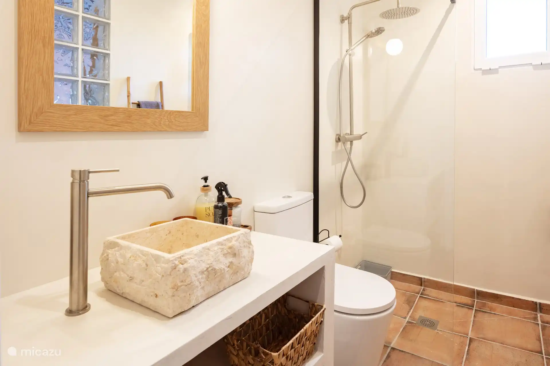 The smaller bathroom.